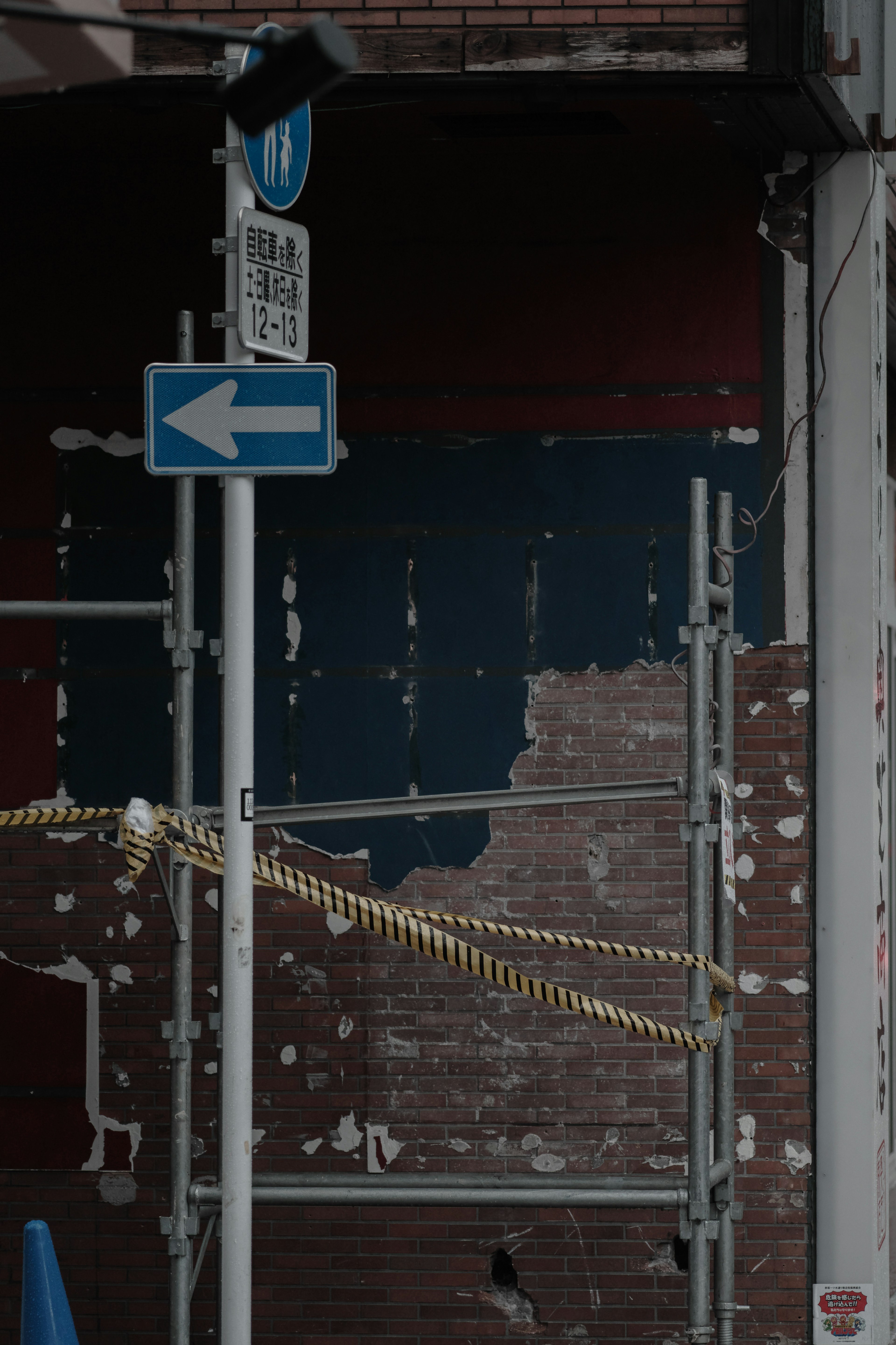 Urban scene featuring an old wall and scaffolding