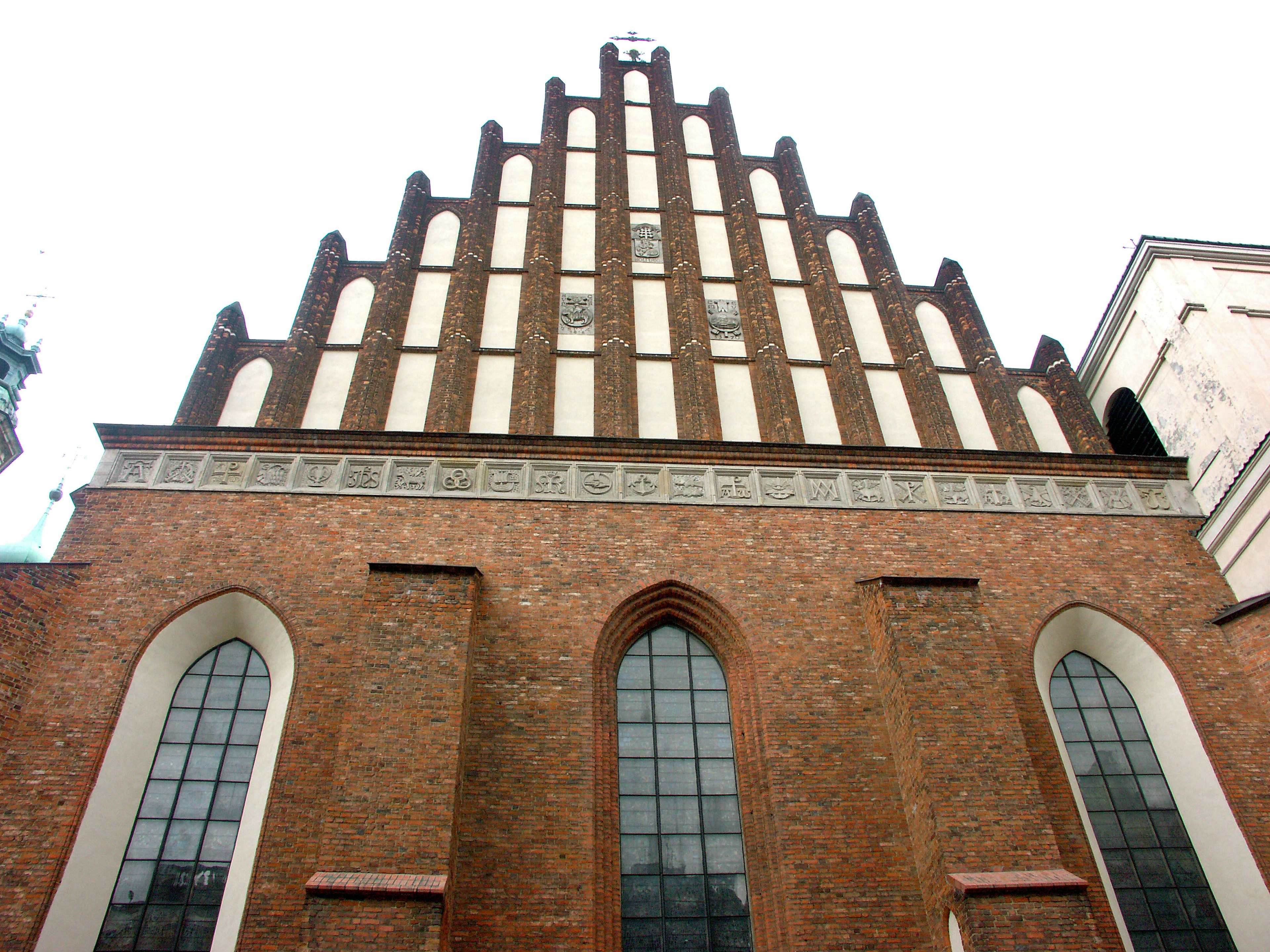 Gothic style brick church facade with pointed arches