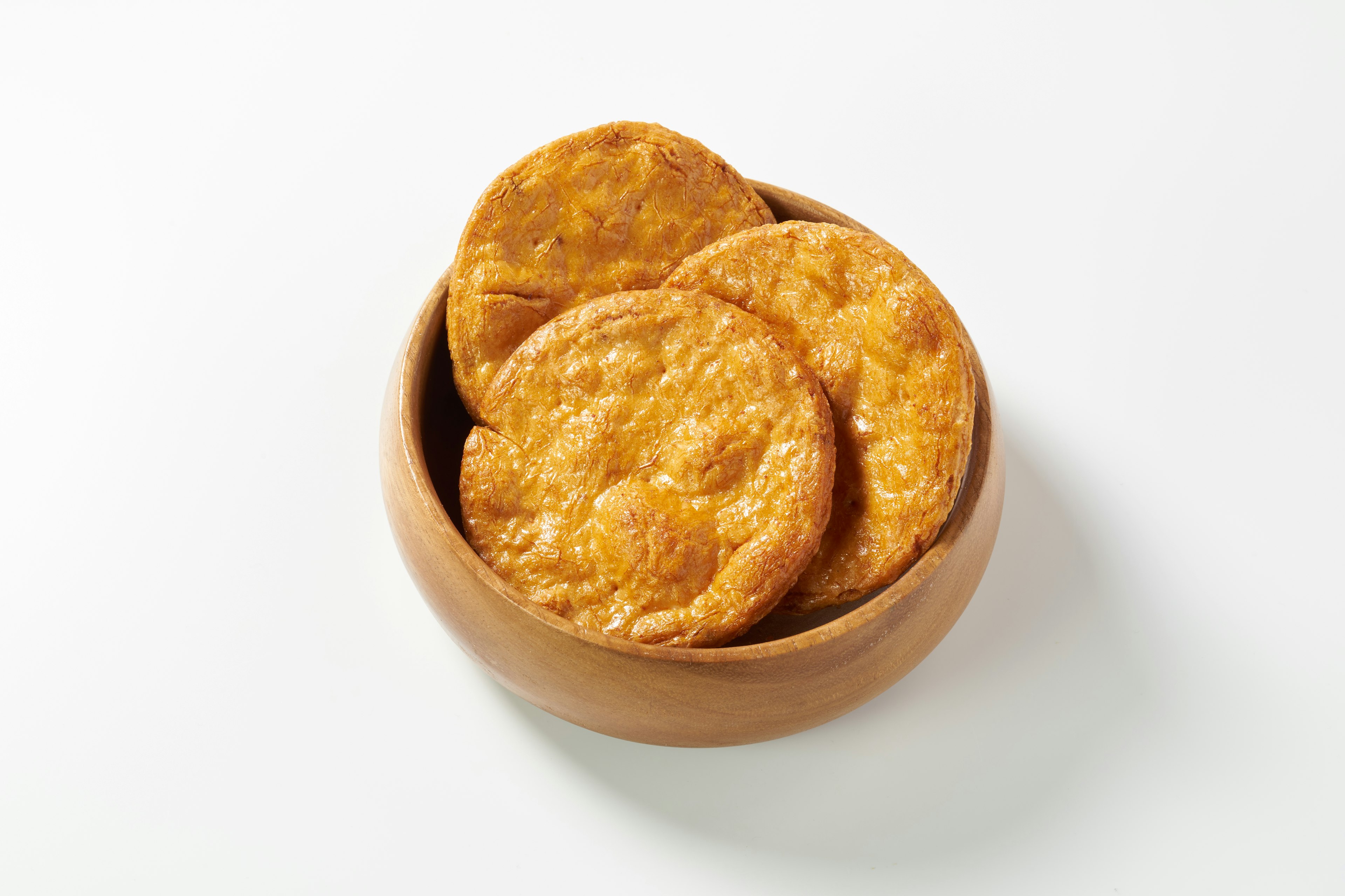 Bowl filled with golden brown cookies