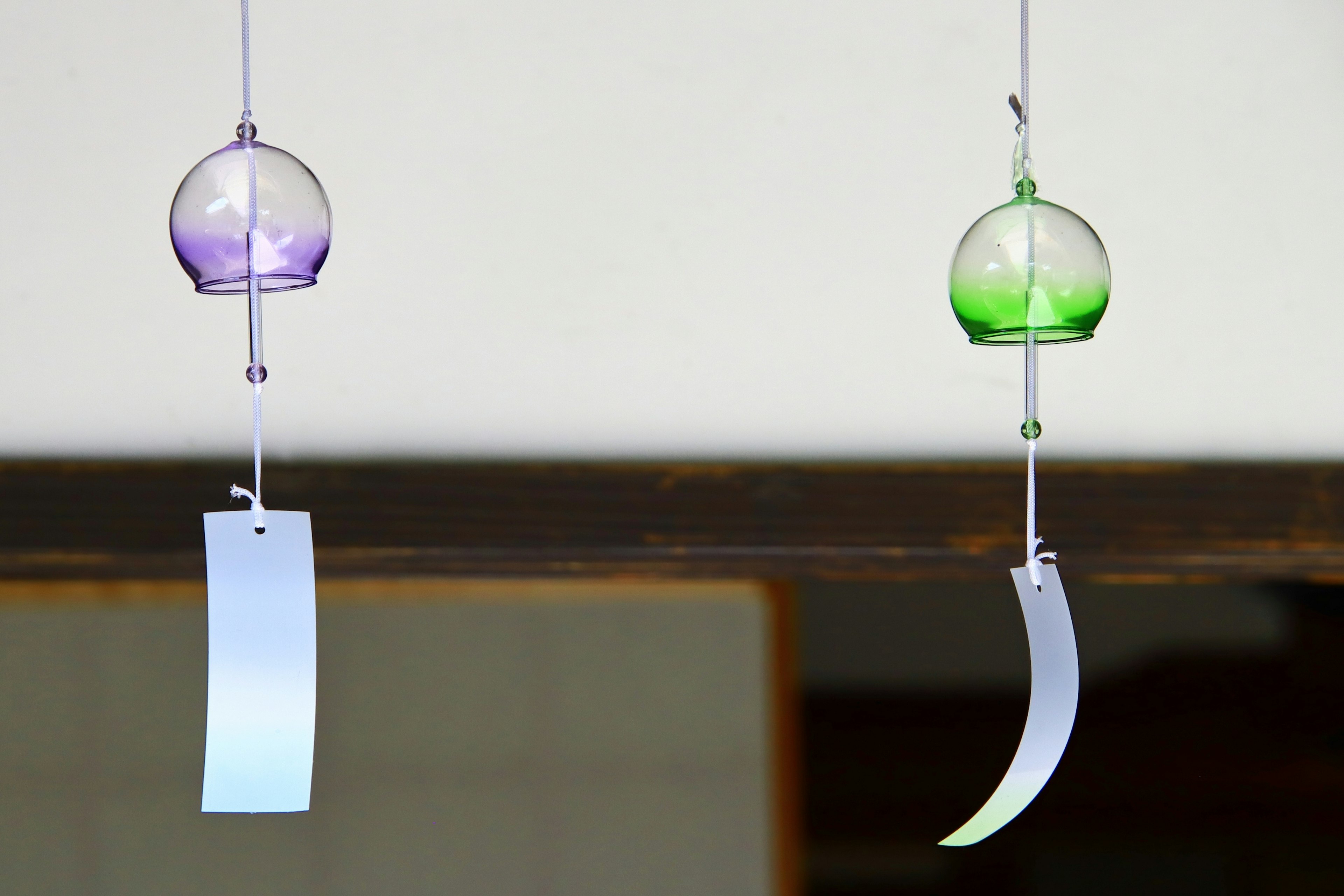 Hanging wind chimes with purple and green glass balls