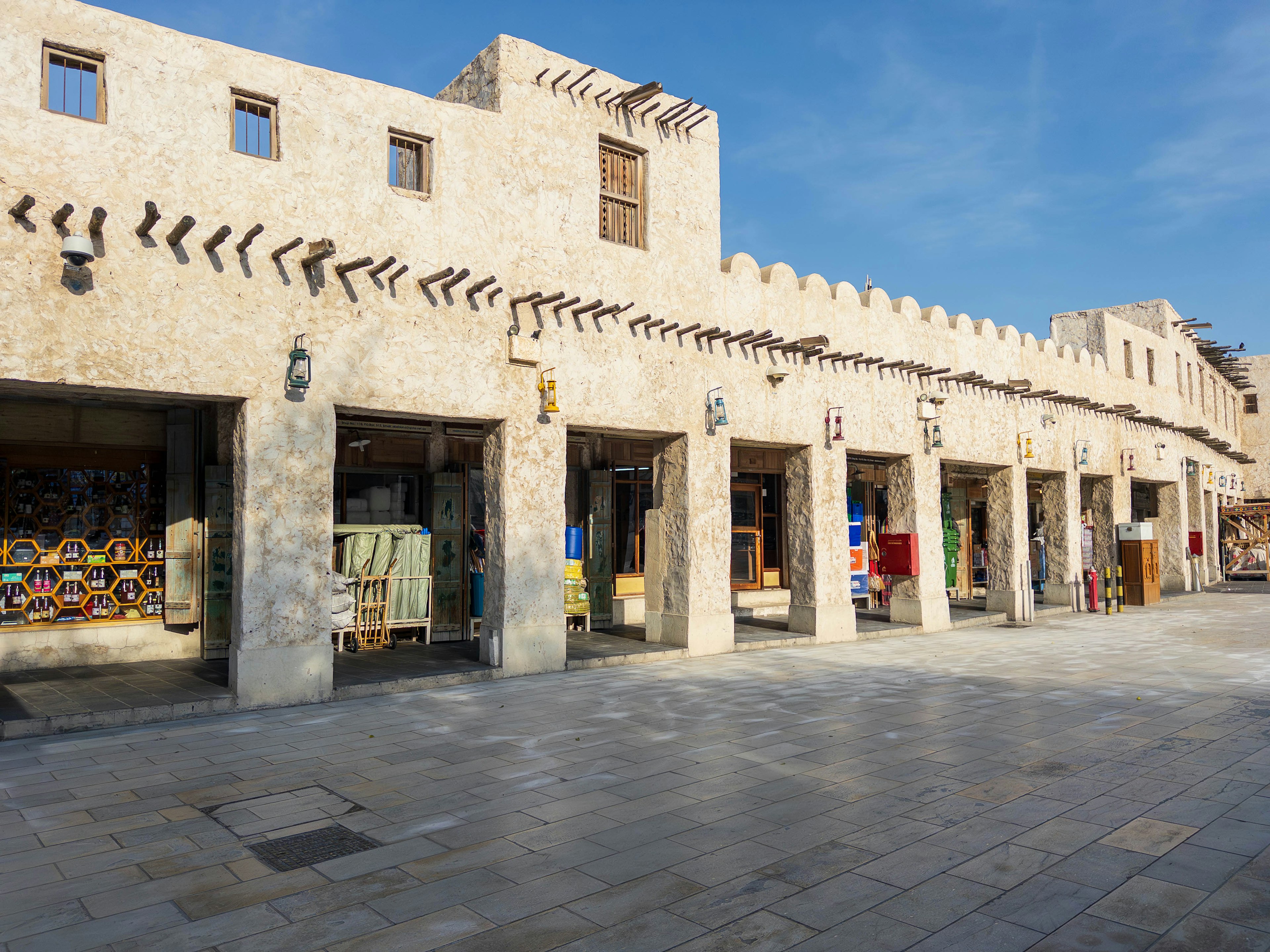 Market scene with traditional buildings under a blue sky