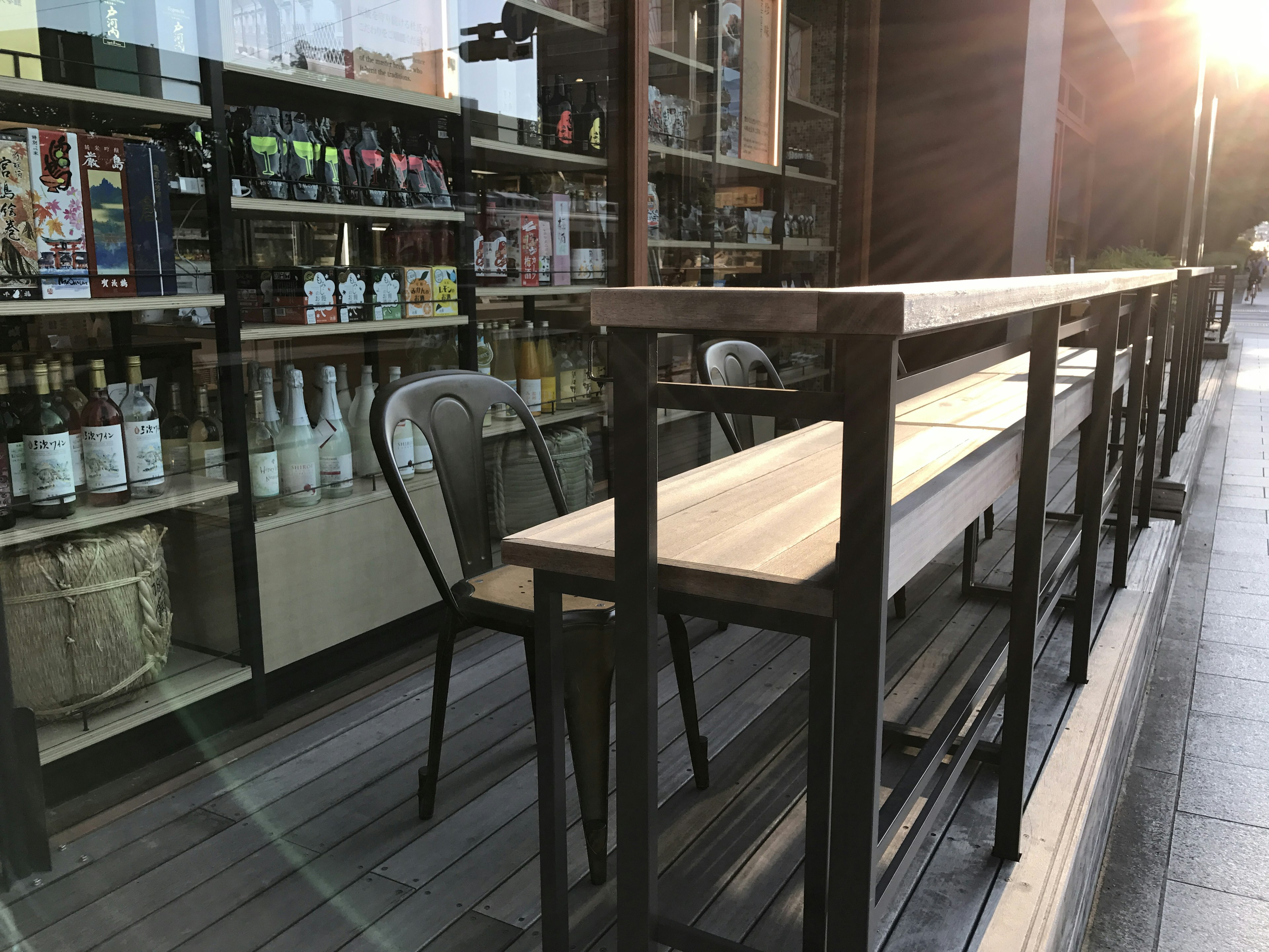 Outdoor café setting with wooden table and metal chairs