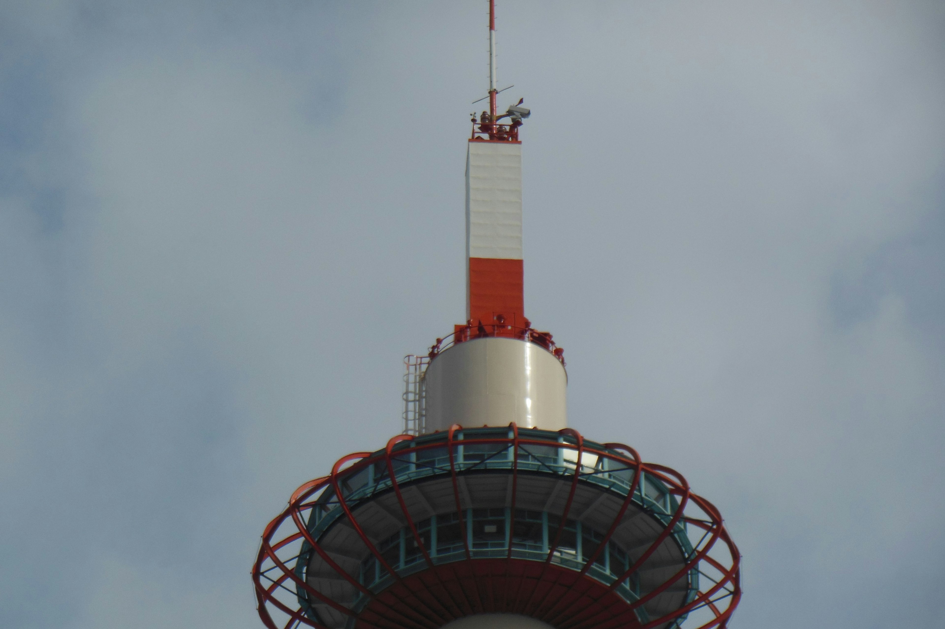 Top section of a tower with red and white colors