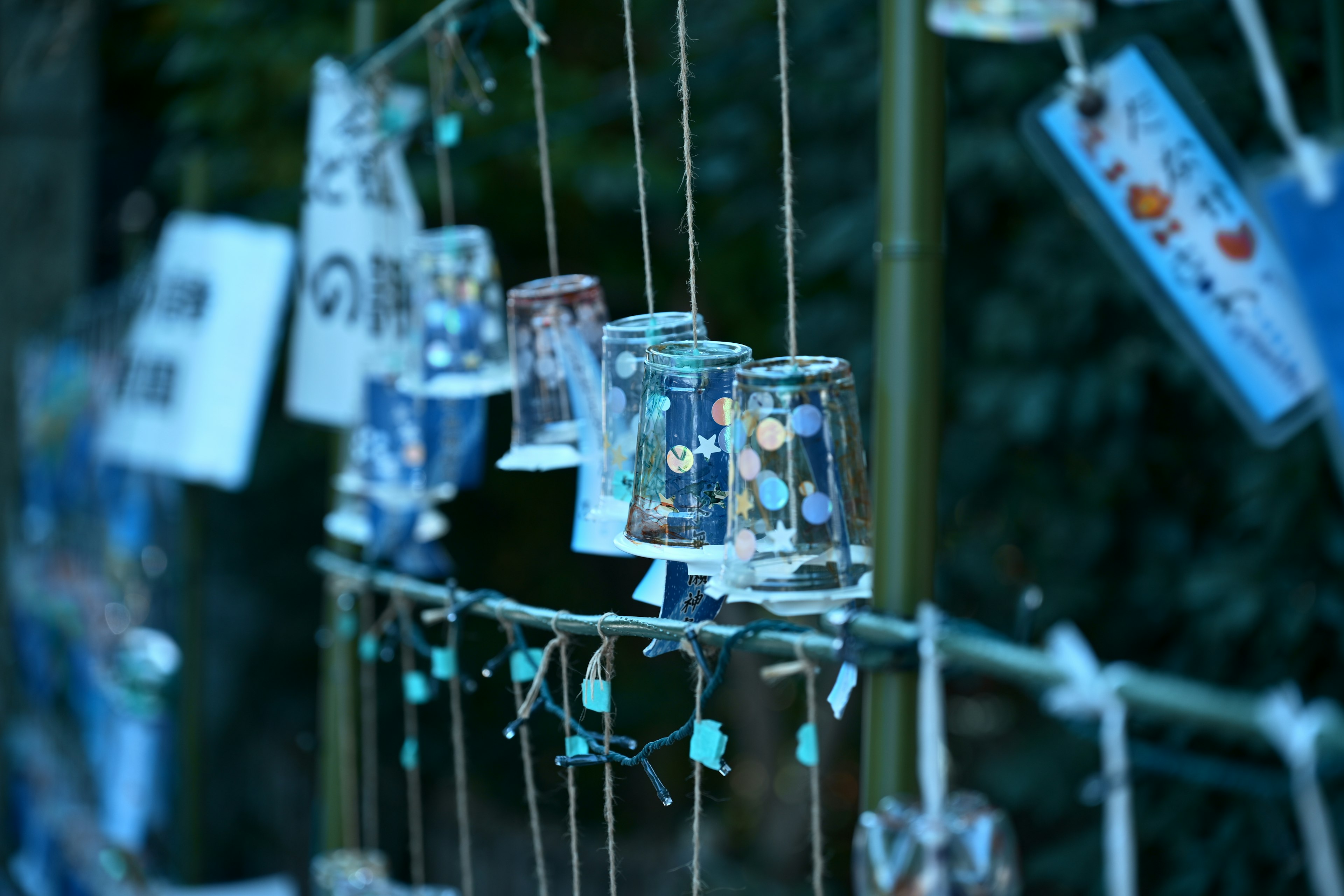 Colorful wind chimes hanging in a serene setting