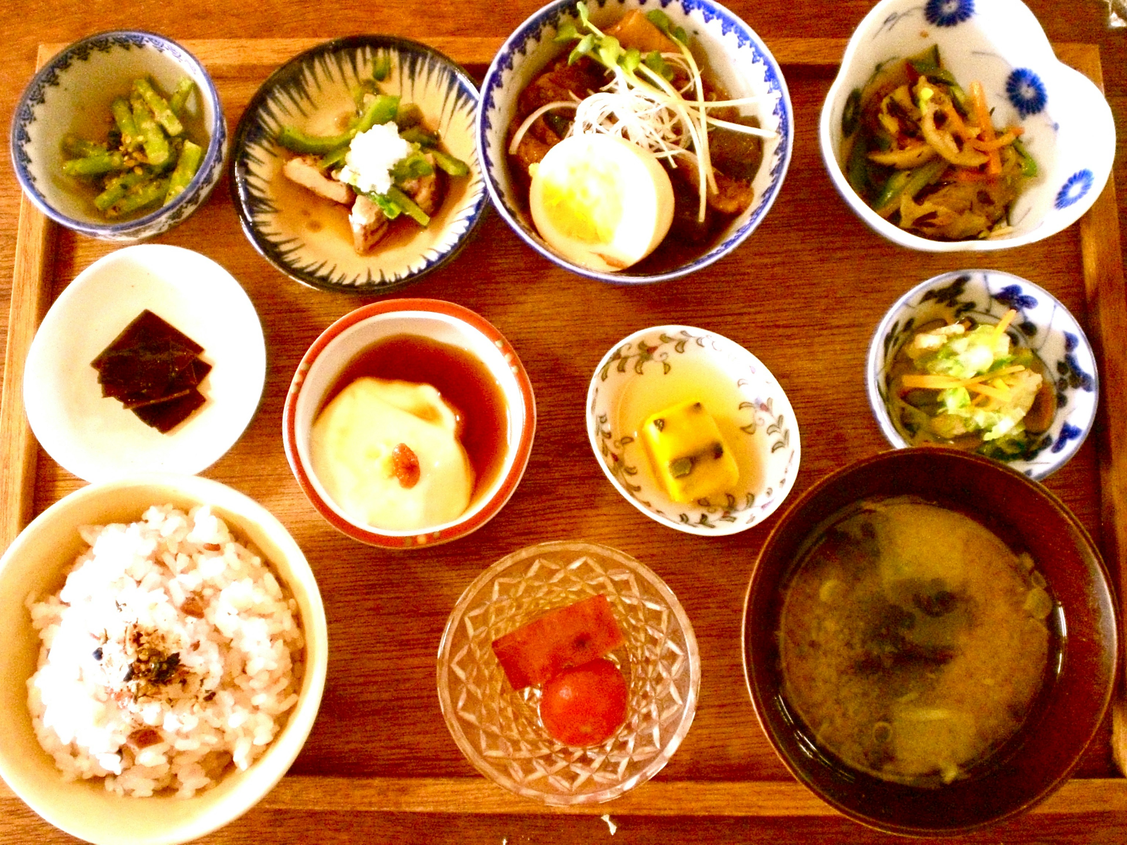 Traditional Japanese breakfast platter featuring various small dishes rice and miso soup