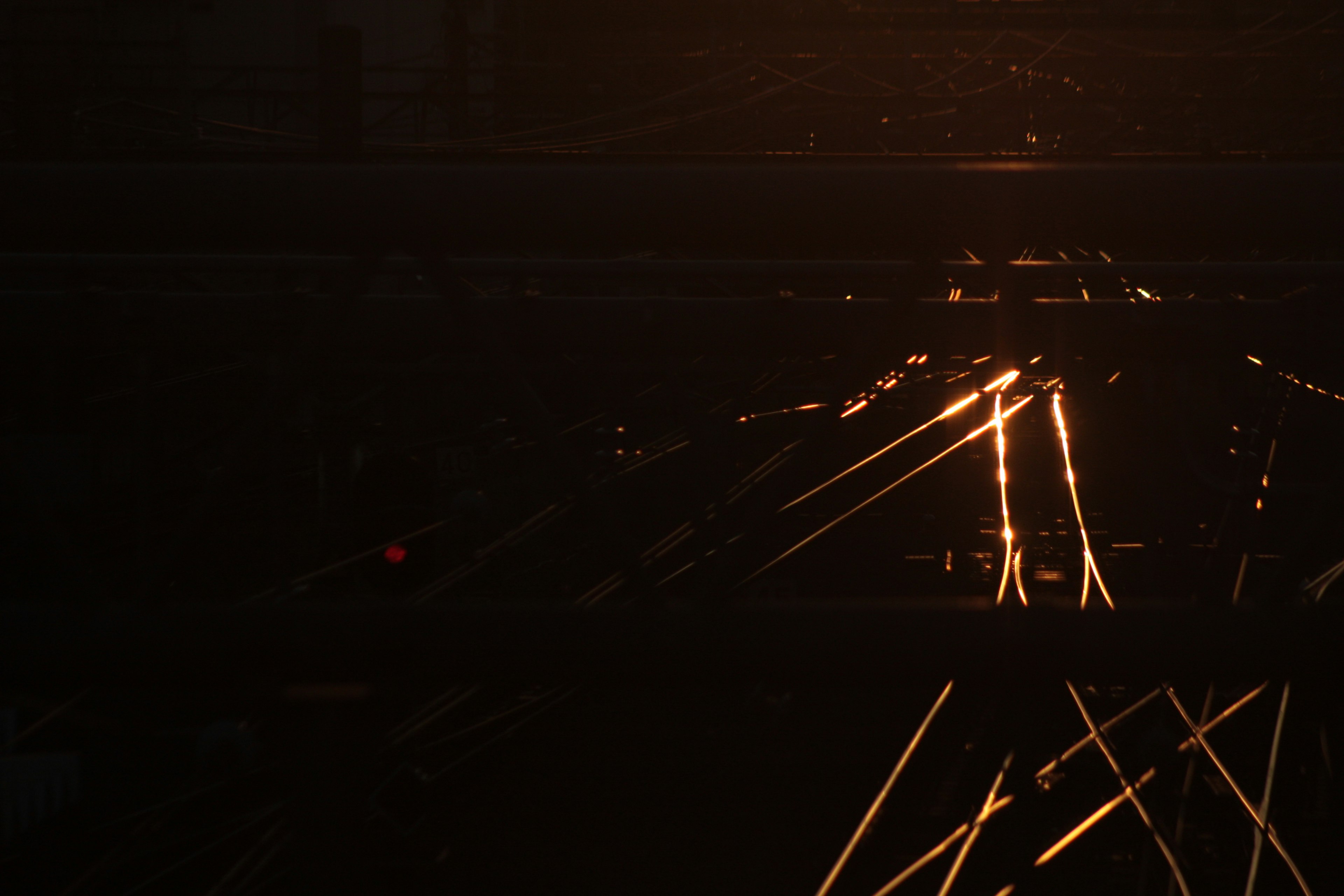 Industrial scene with bright sparks against a dark background