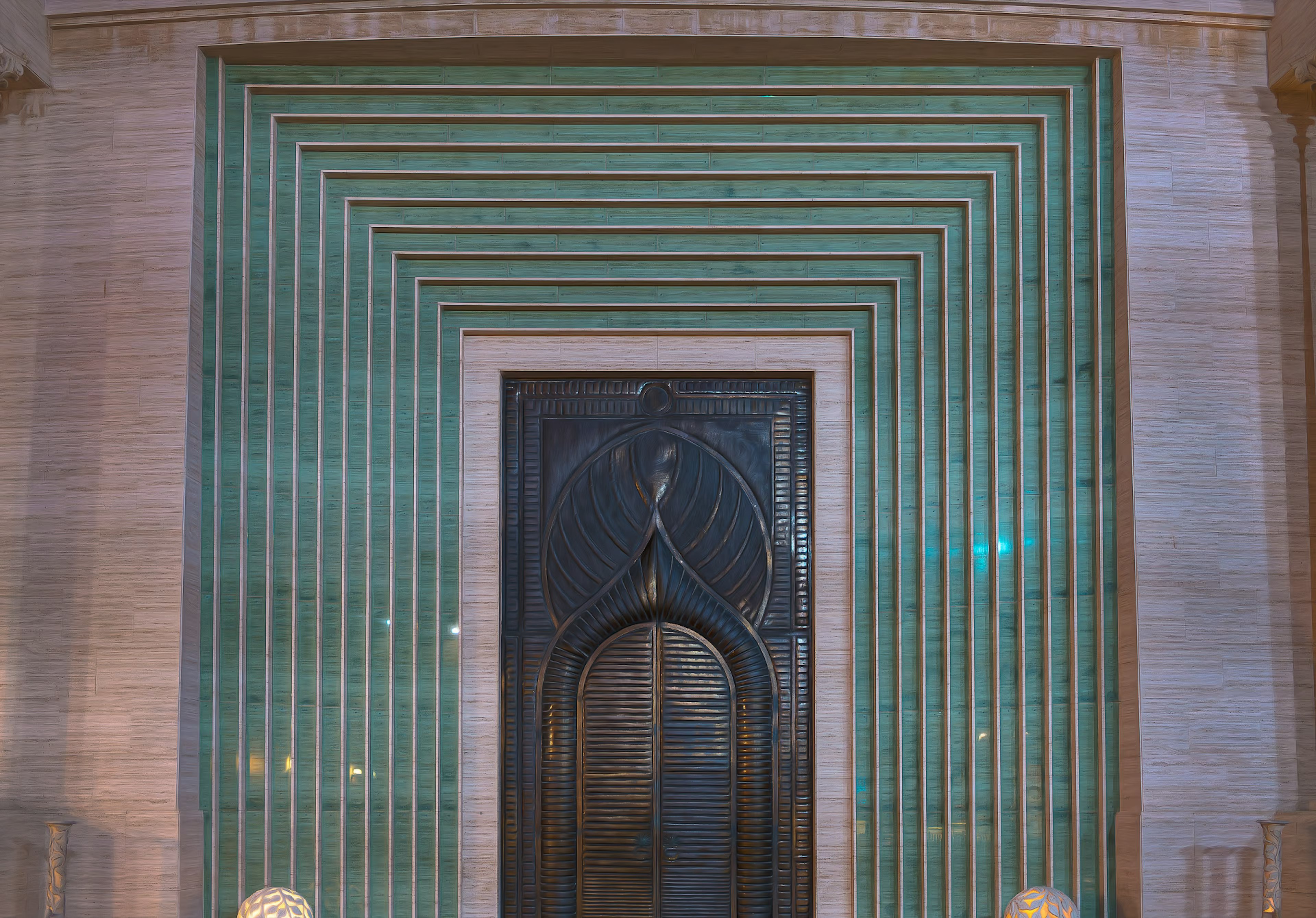 Front view of a black door framed by green lines