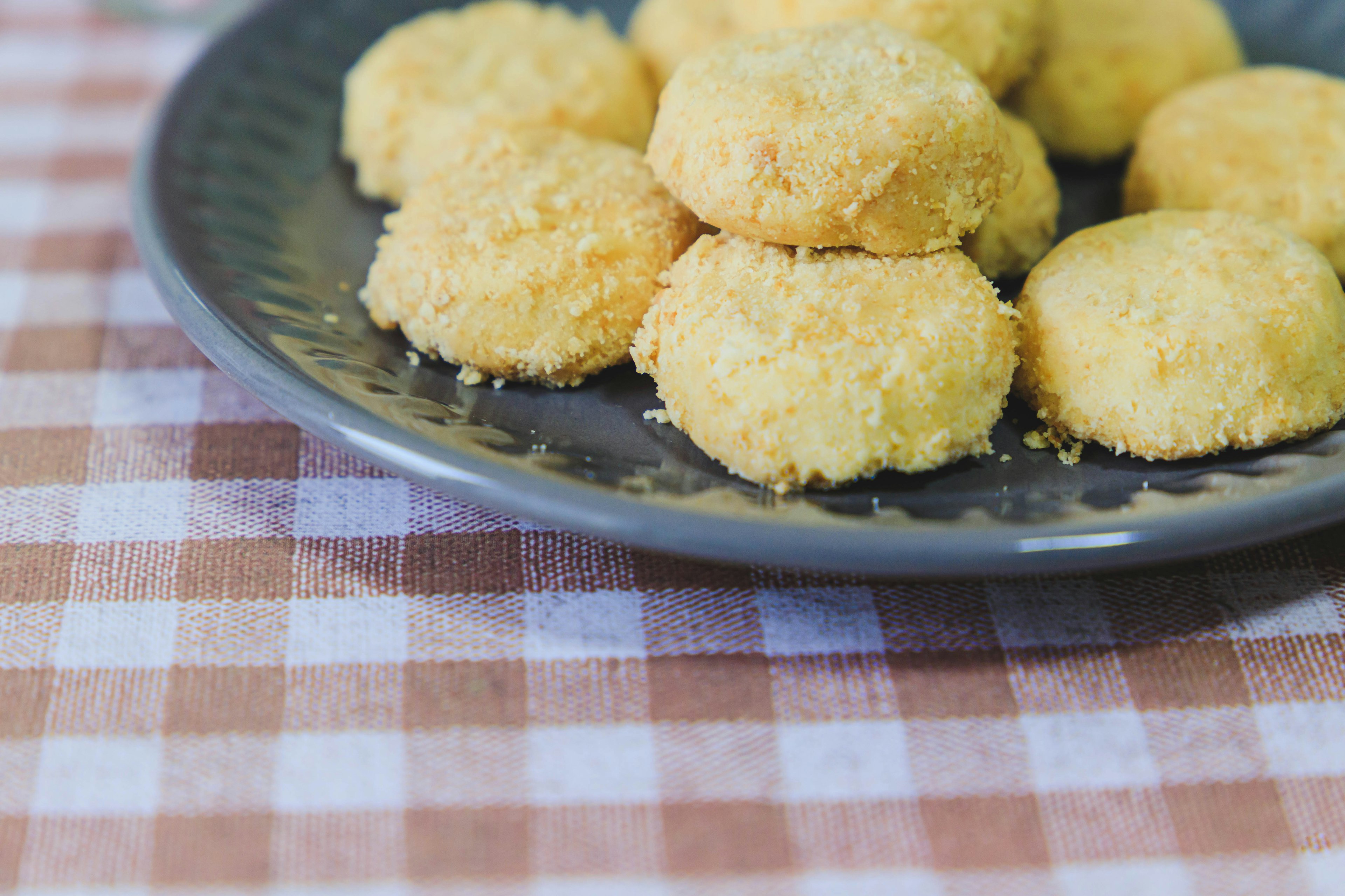 Yellow cookies arranged on a plate