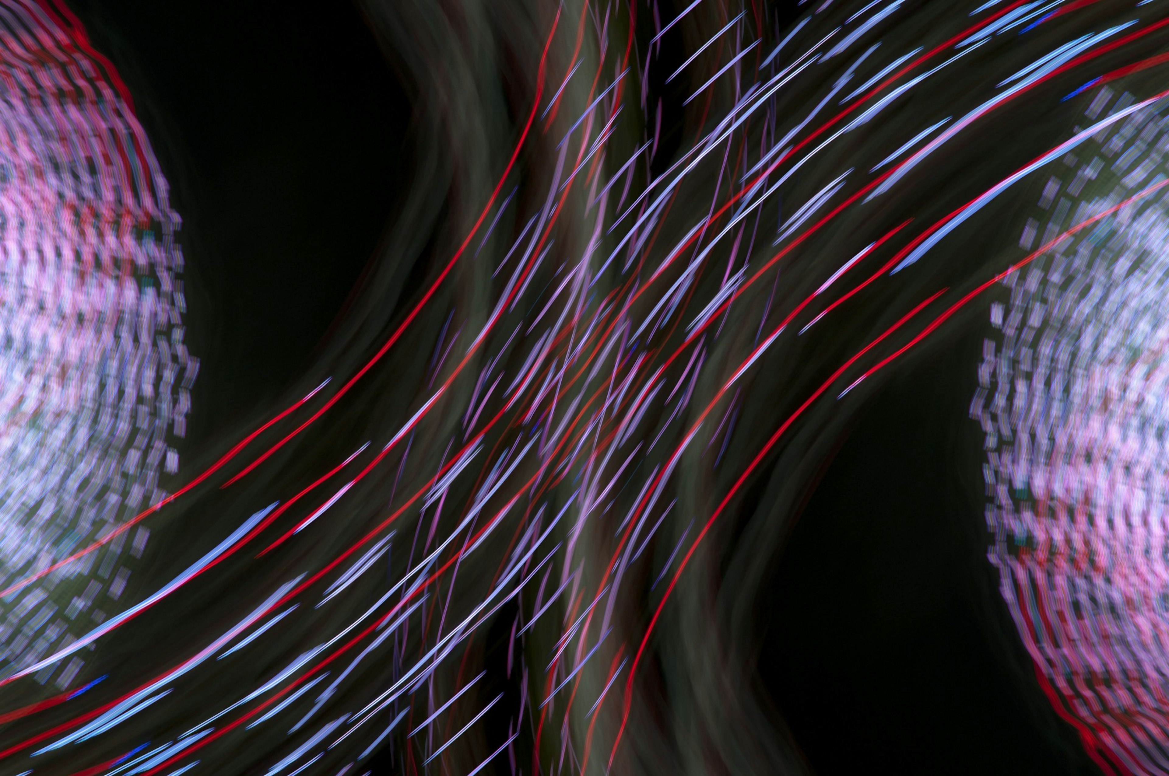 Abstract design of intersecting light flows Red and blue light streams stand out against a dark background