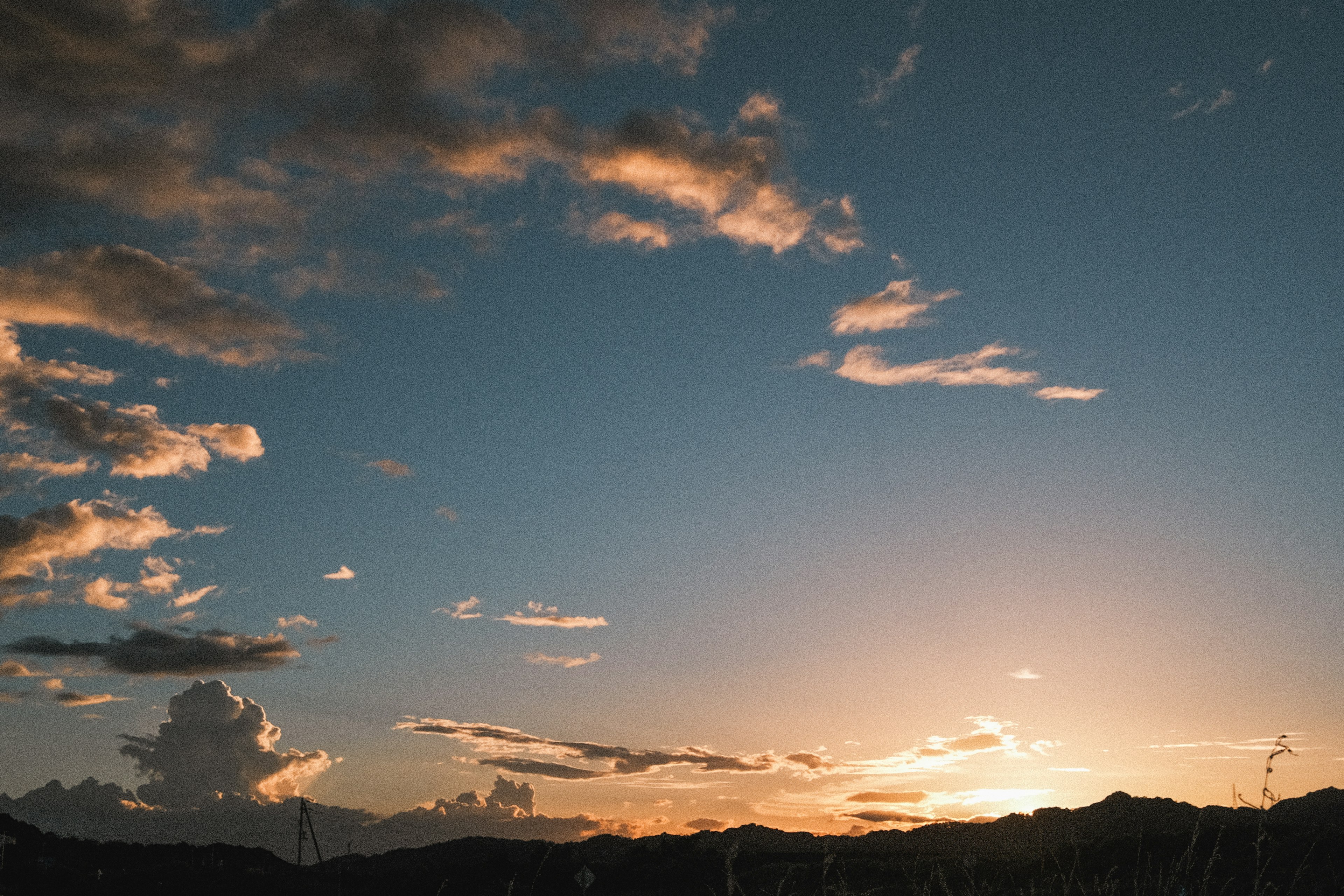 Sunset sky with scattered clouds