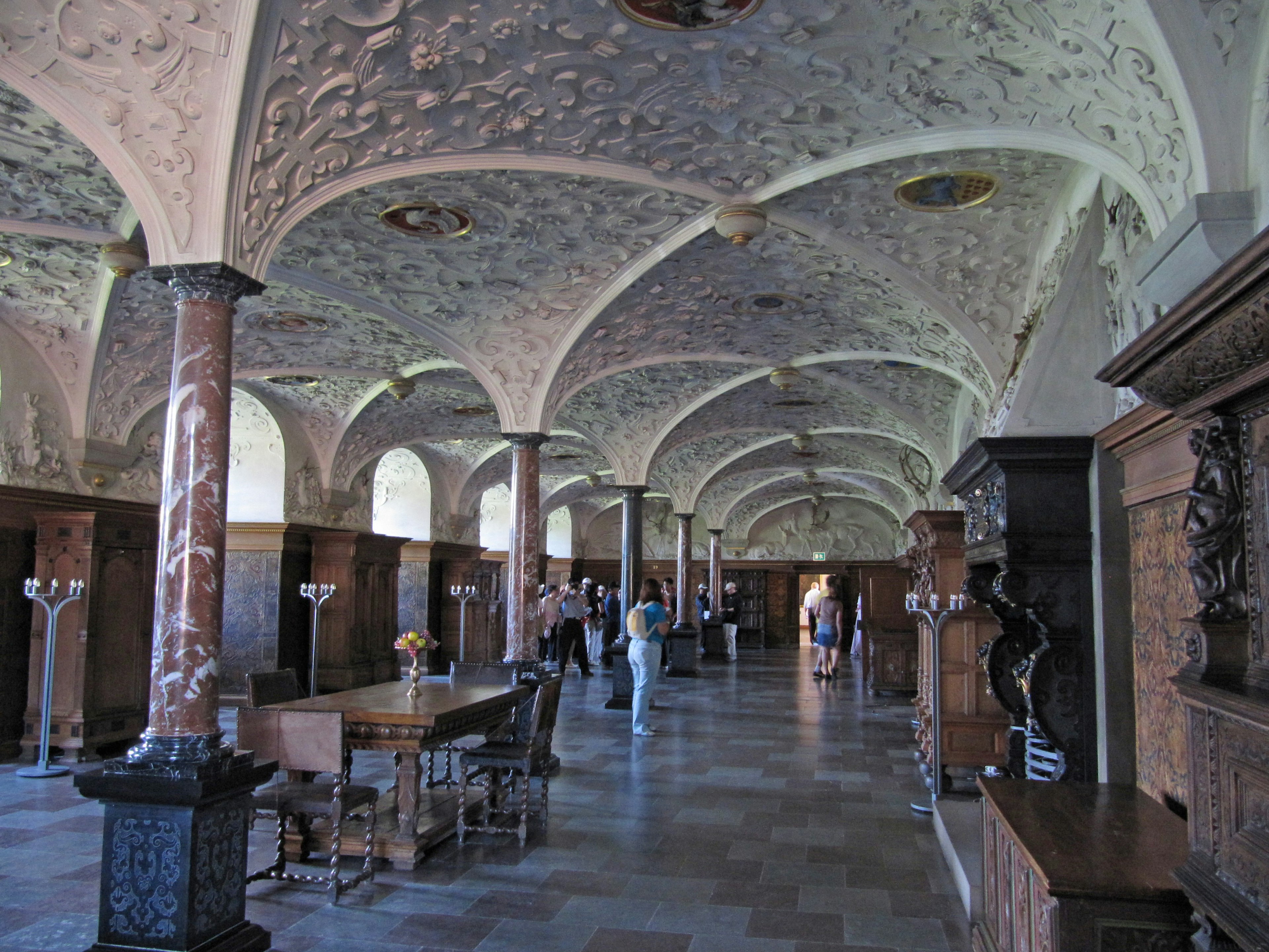 Spacious hall featuring beautiful arched ceilings and decorative columns