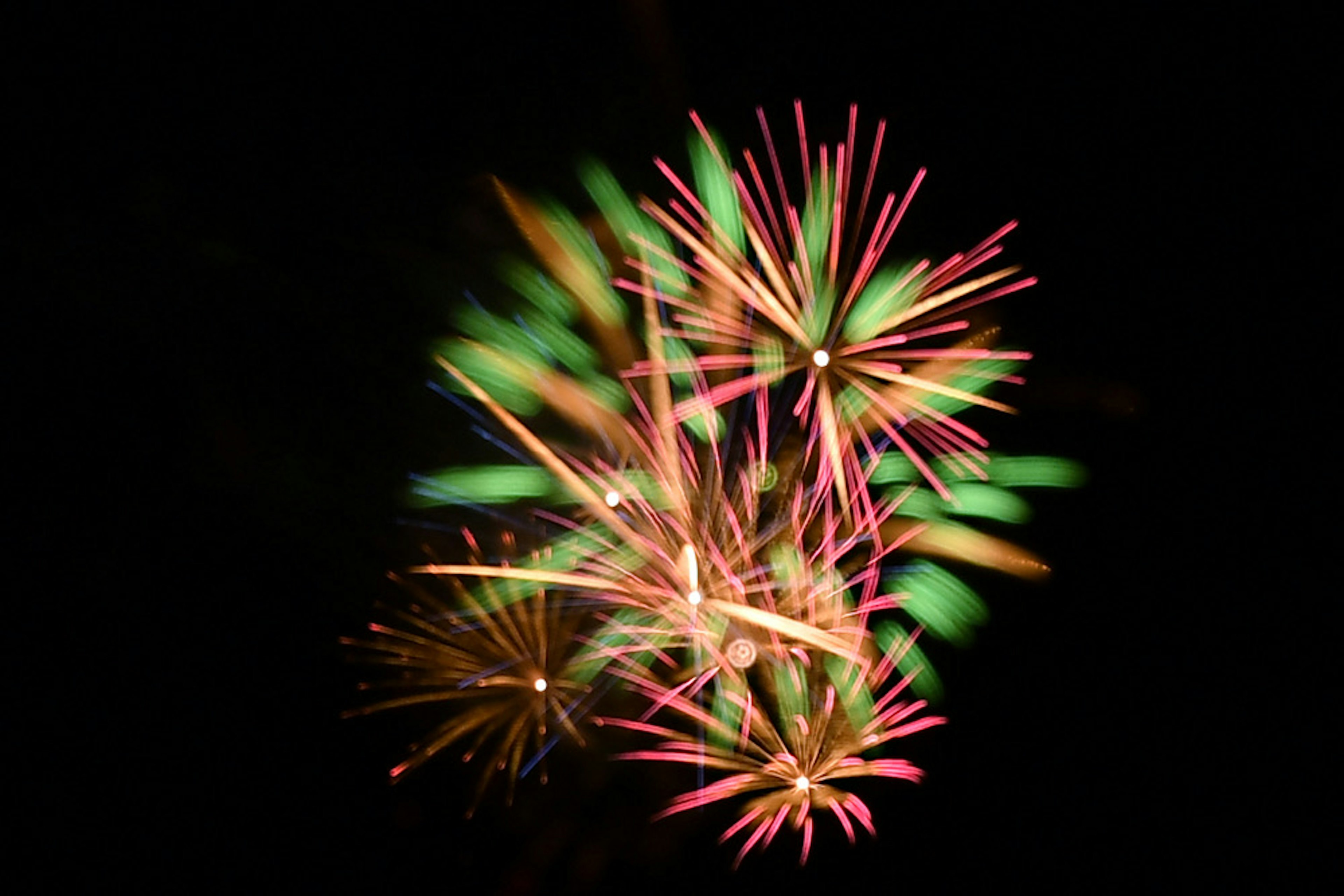 Colorful fireworks bursting against a black background