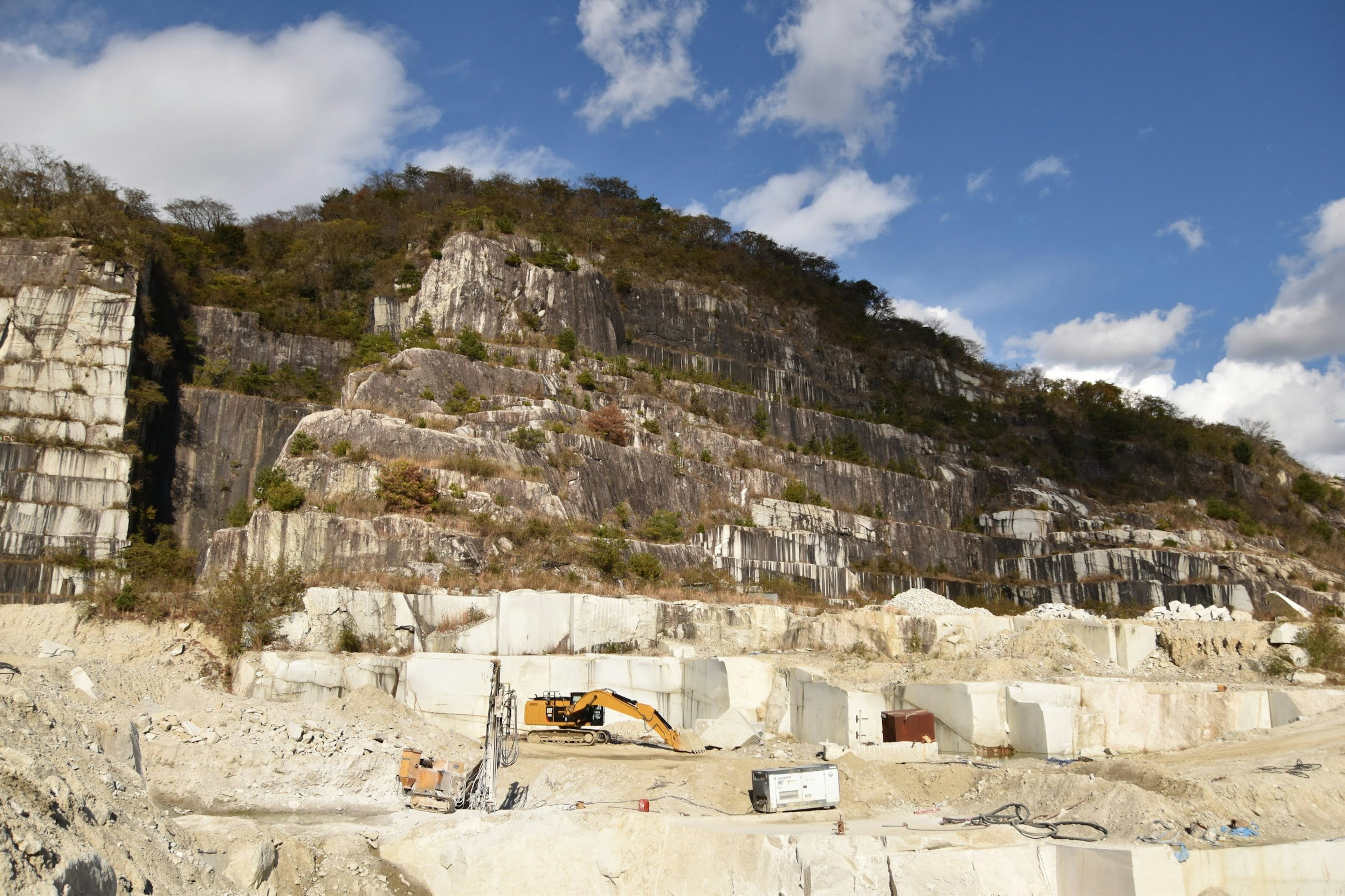 Landscape featuring rocky hillside and quarry site