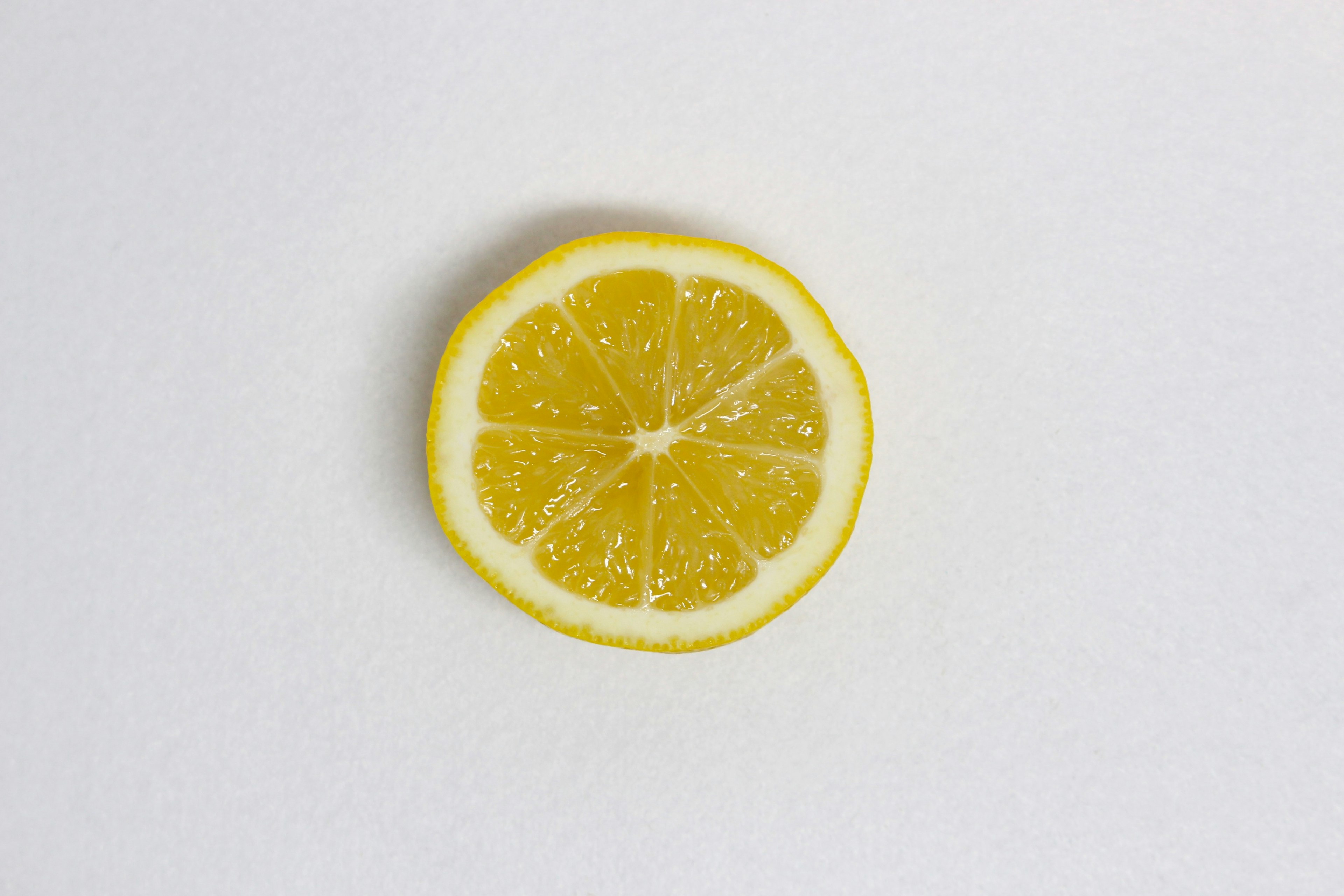 Fresh lemon slice on a white background