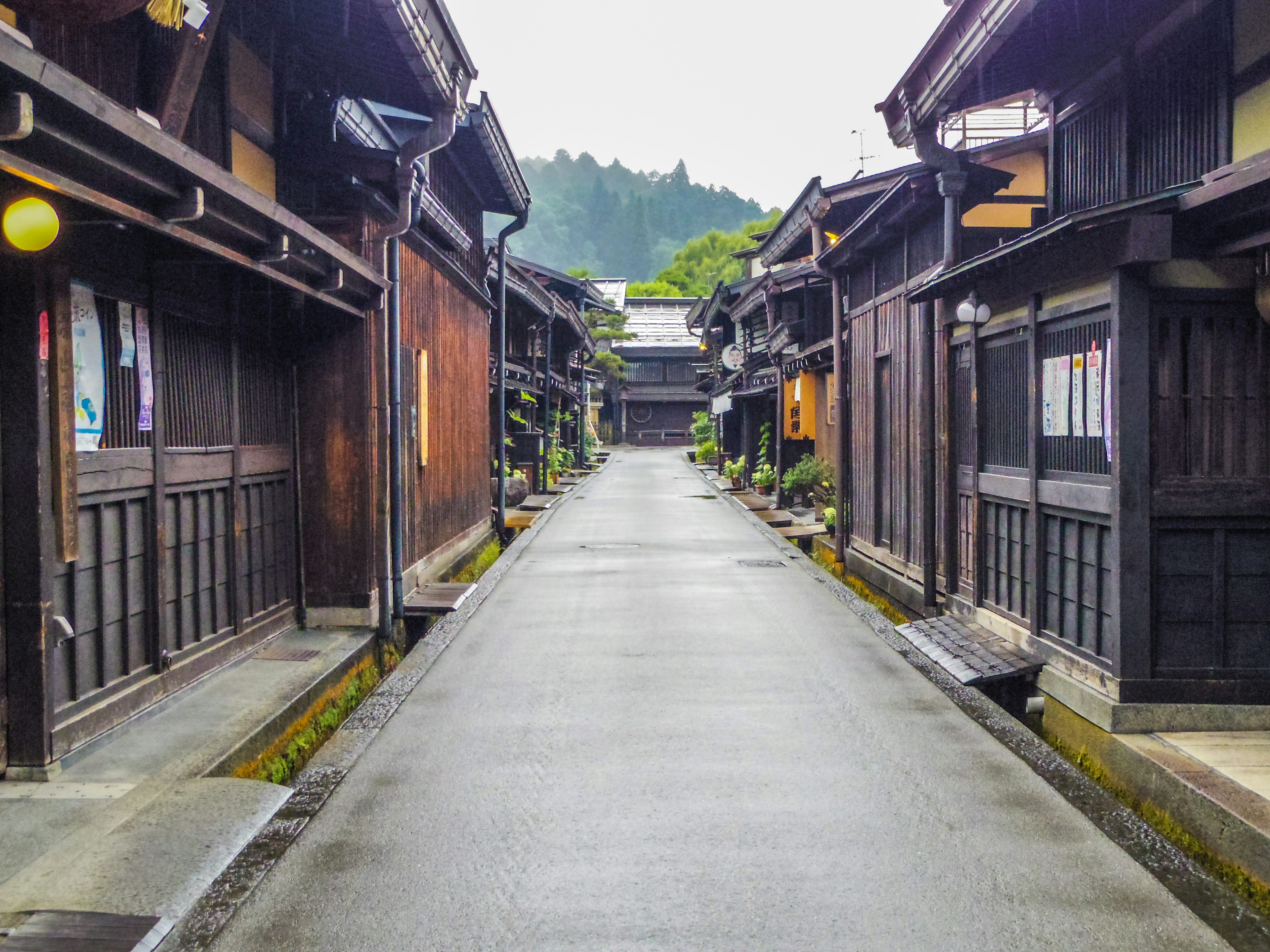 Quiet street lined with wooden buildings in an old town