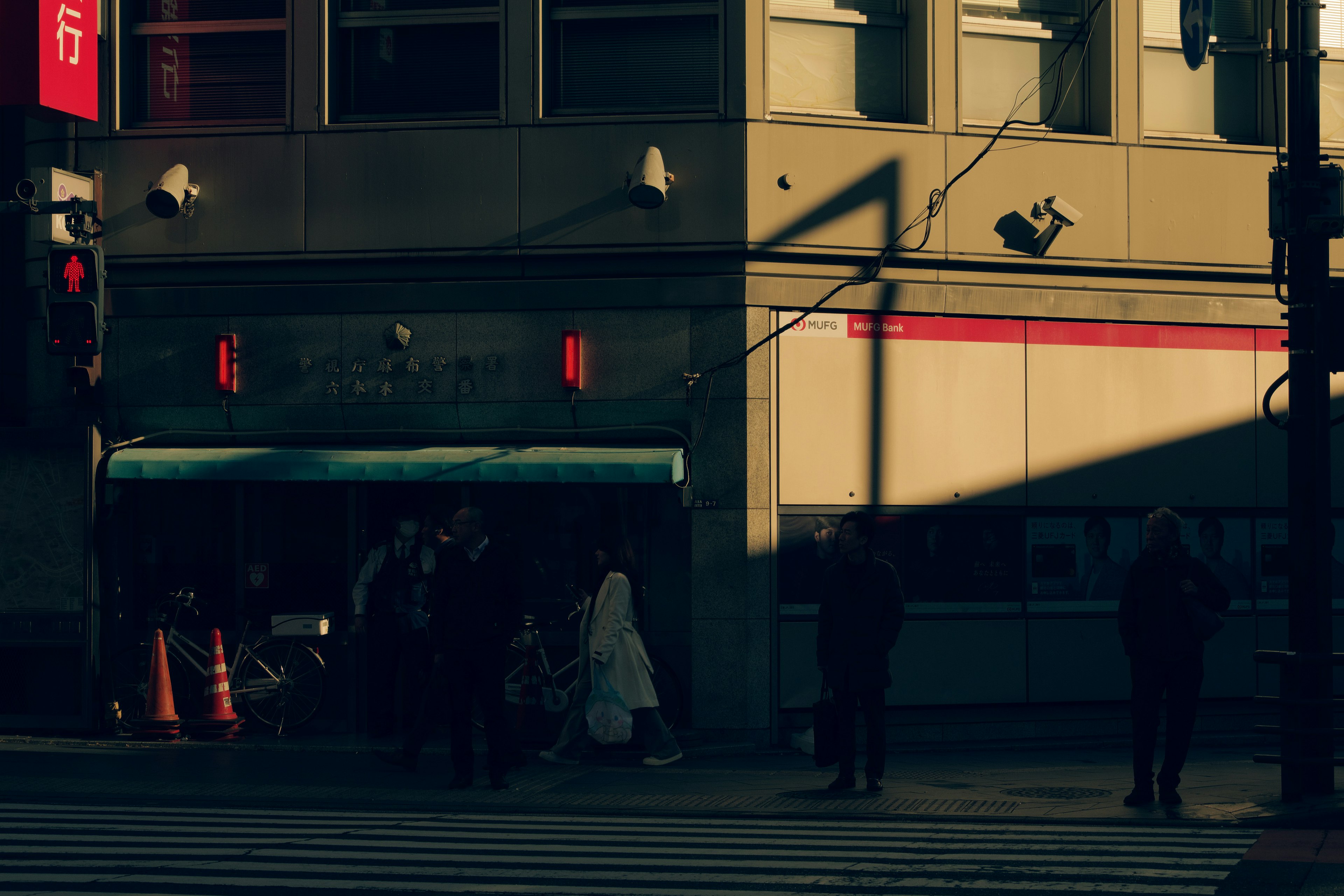 Urban scene with people walking in shadowy light