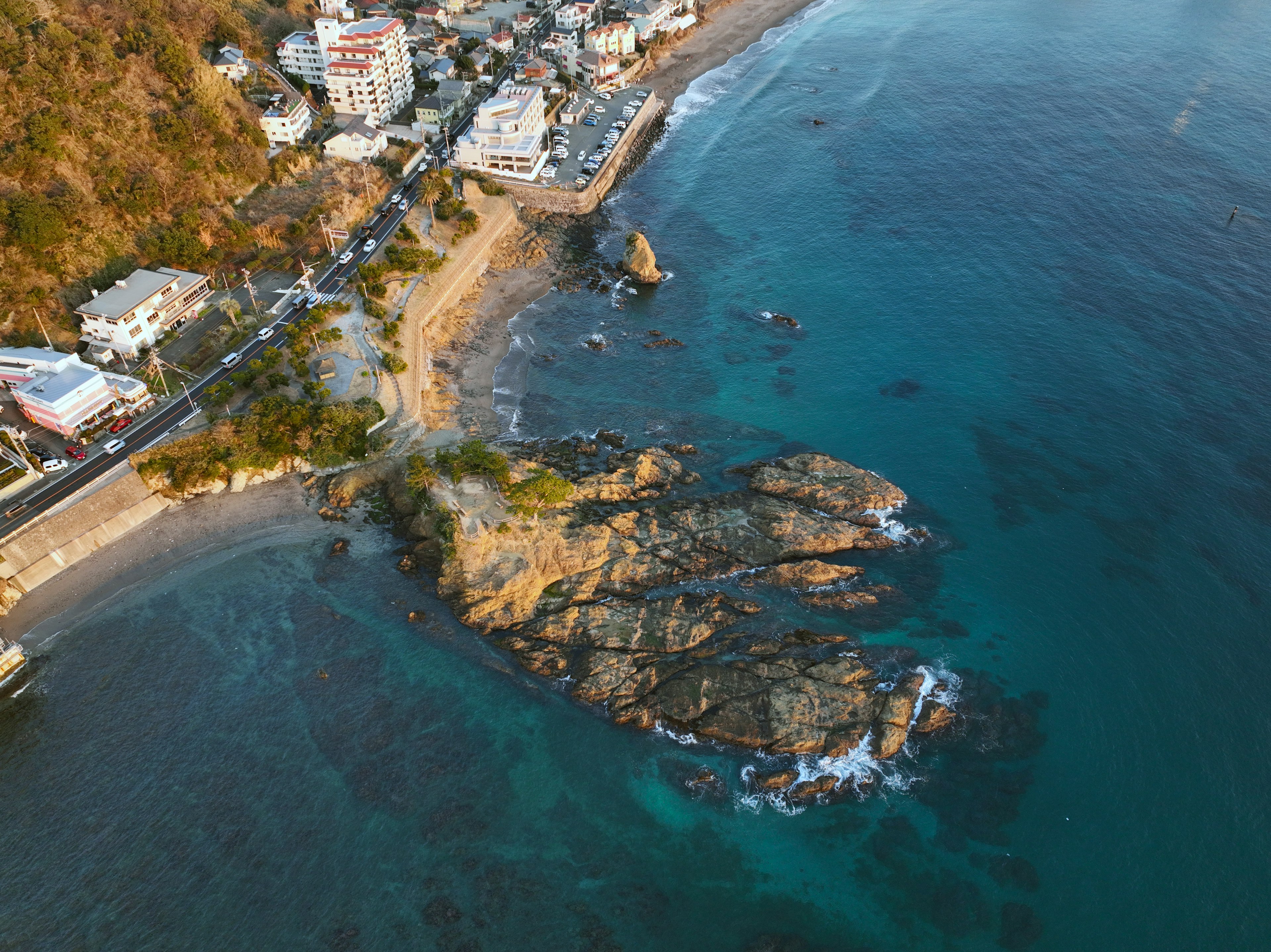 Aerial view of a coastal area with rocks and buildings