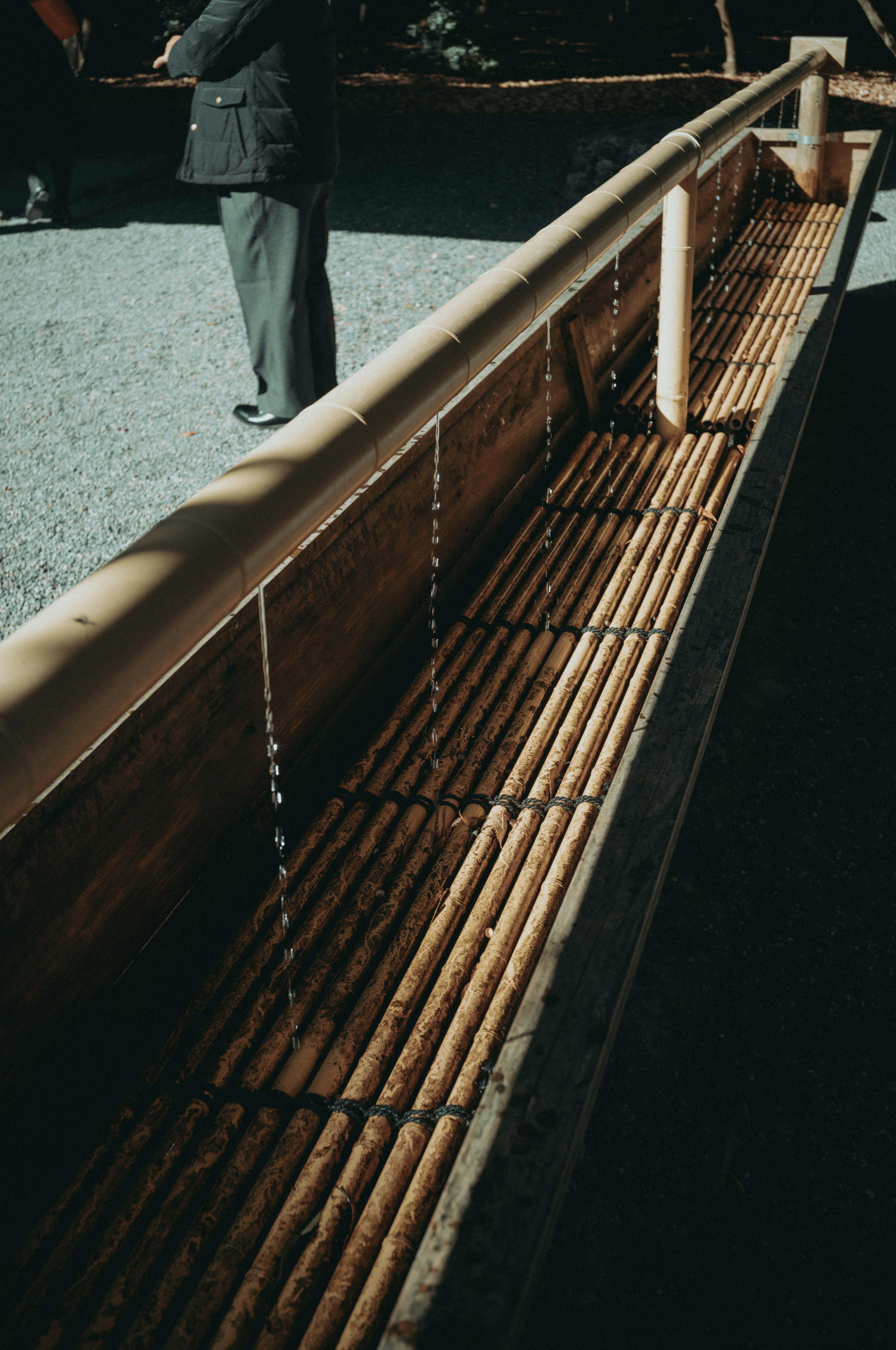 Image of a bamboo water basin with flowing water