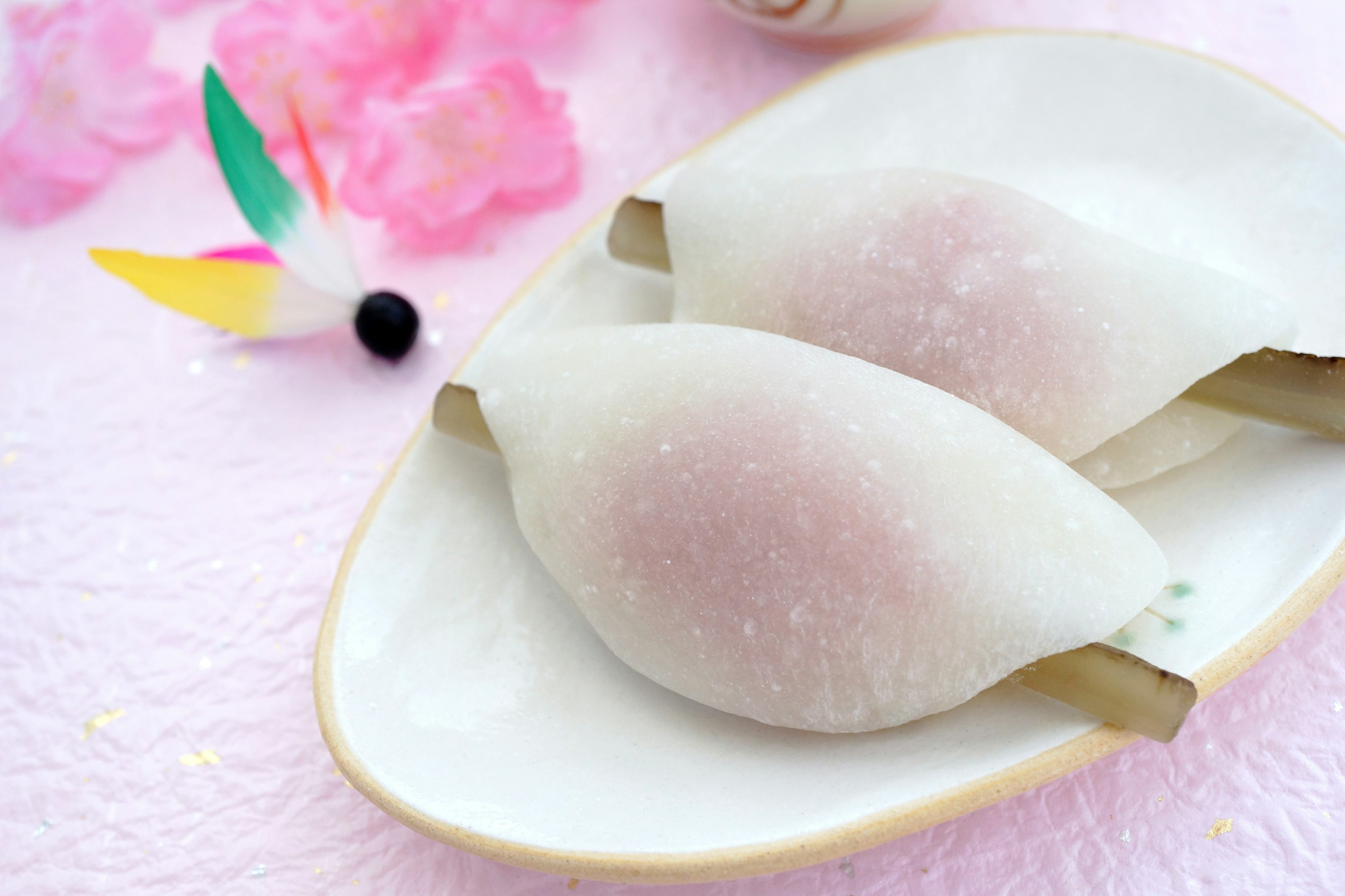 Delicate pink and white Japanese sweets on a white plate