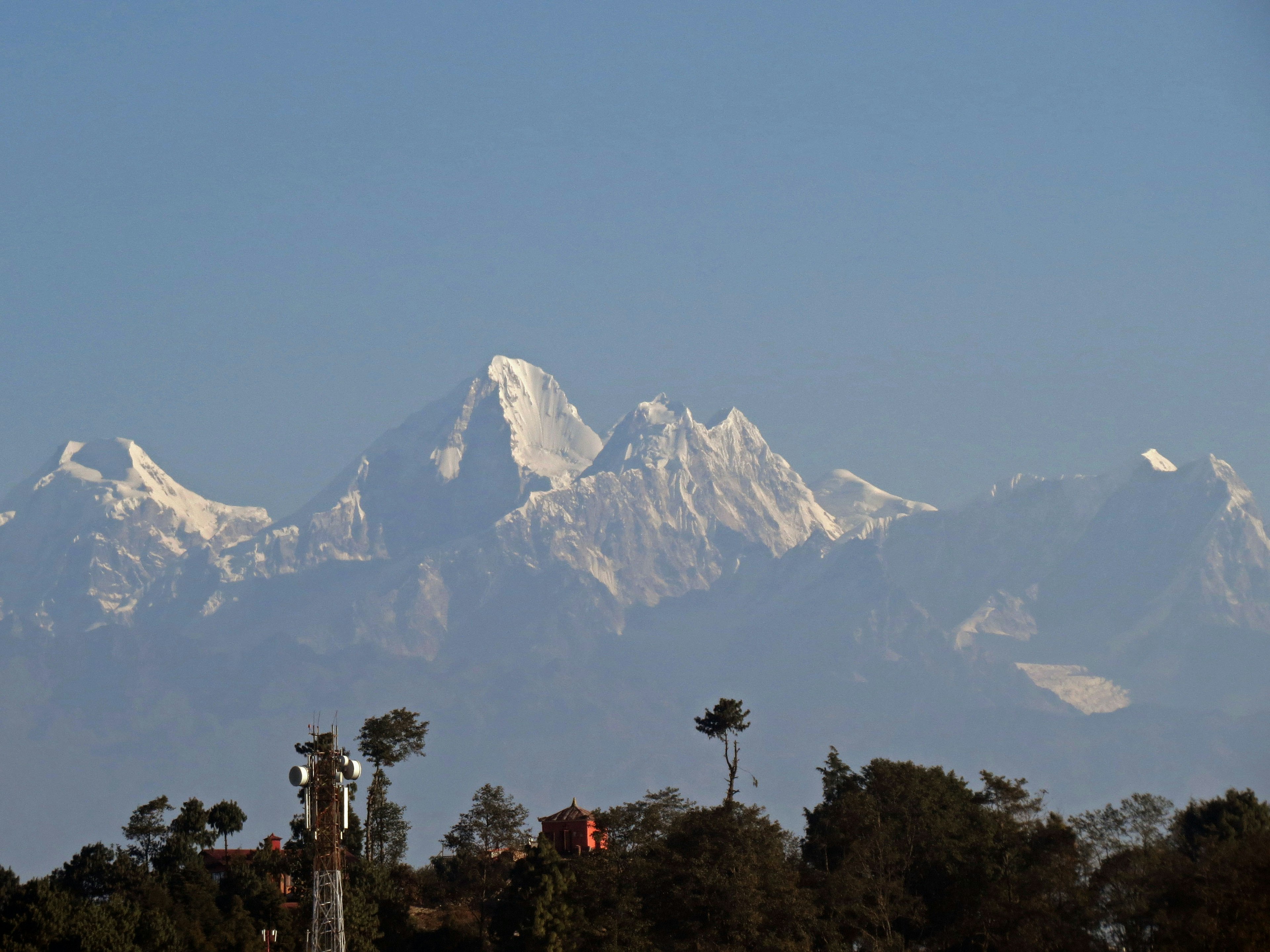 Snow-capped mountains under a clear blue sky