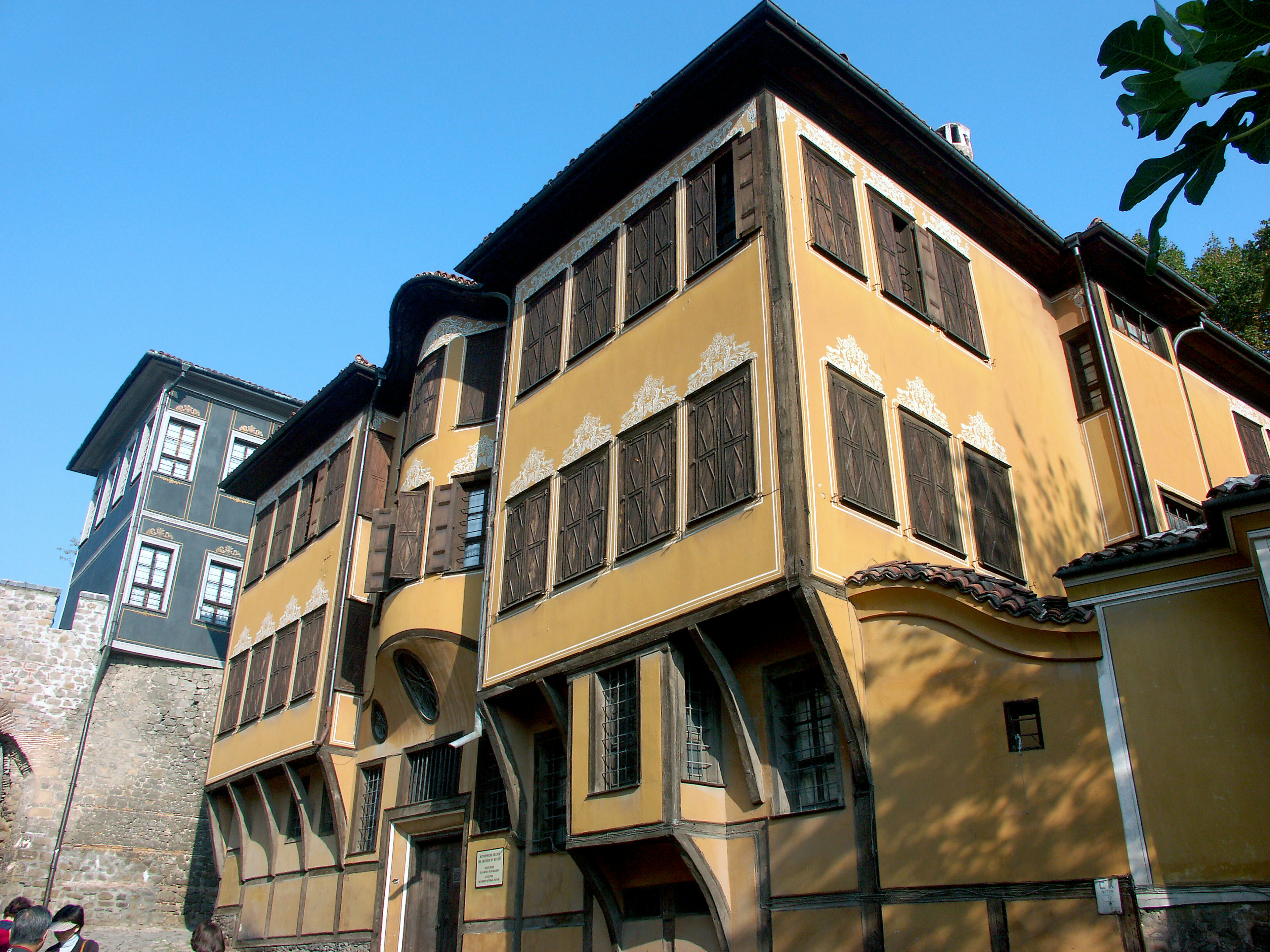 Historical building with beautiful yellow facade featuring numerous windows