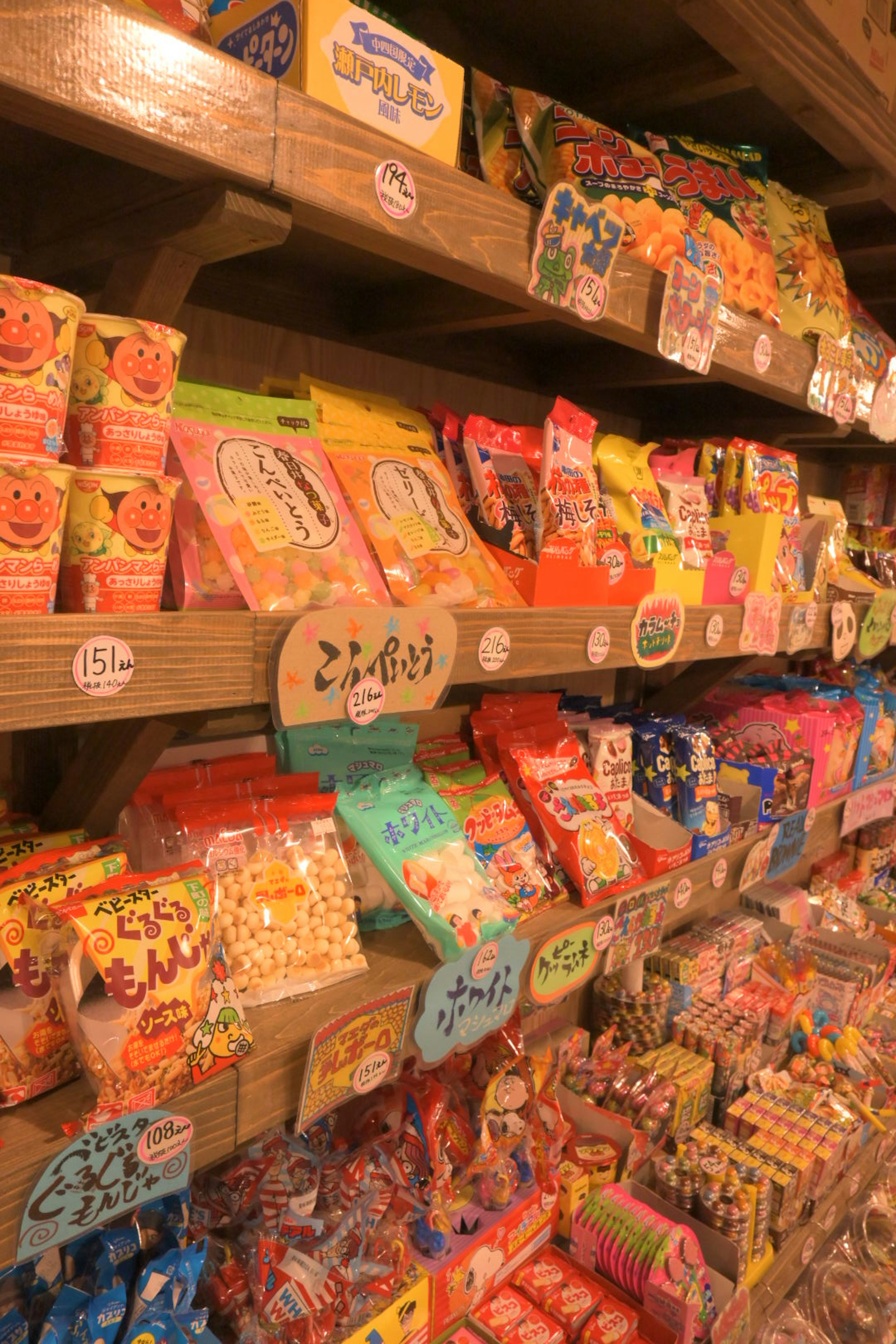 Colorful candy displayed on wooden shelves