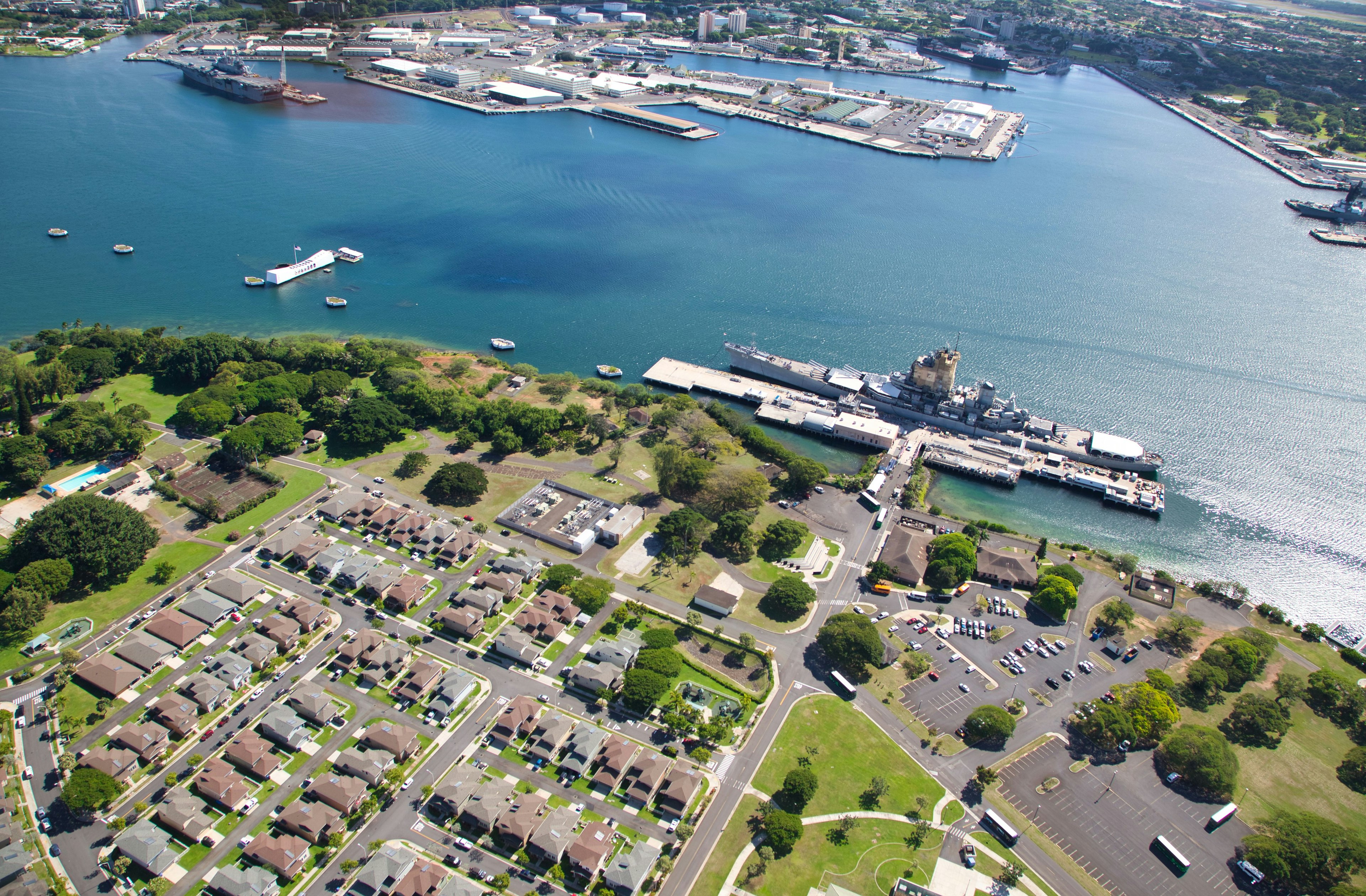 Aerial view of a residential area near the ocean and a harbor