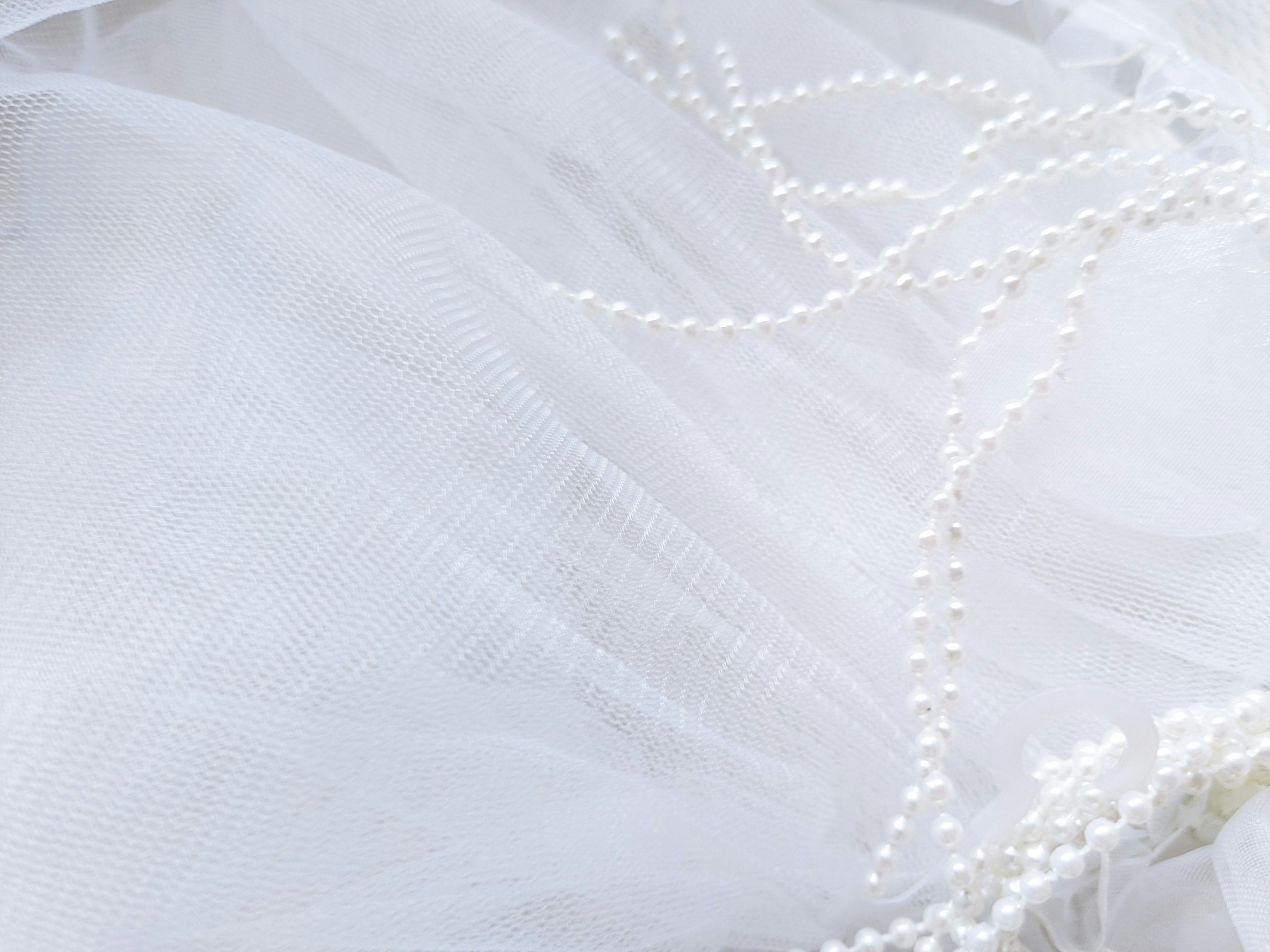 Elegant white tulle with pearl detailing