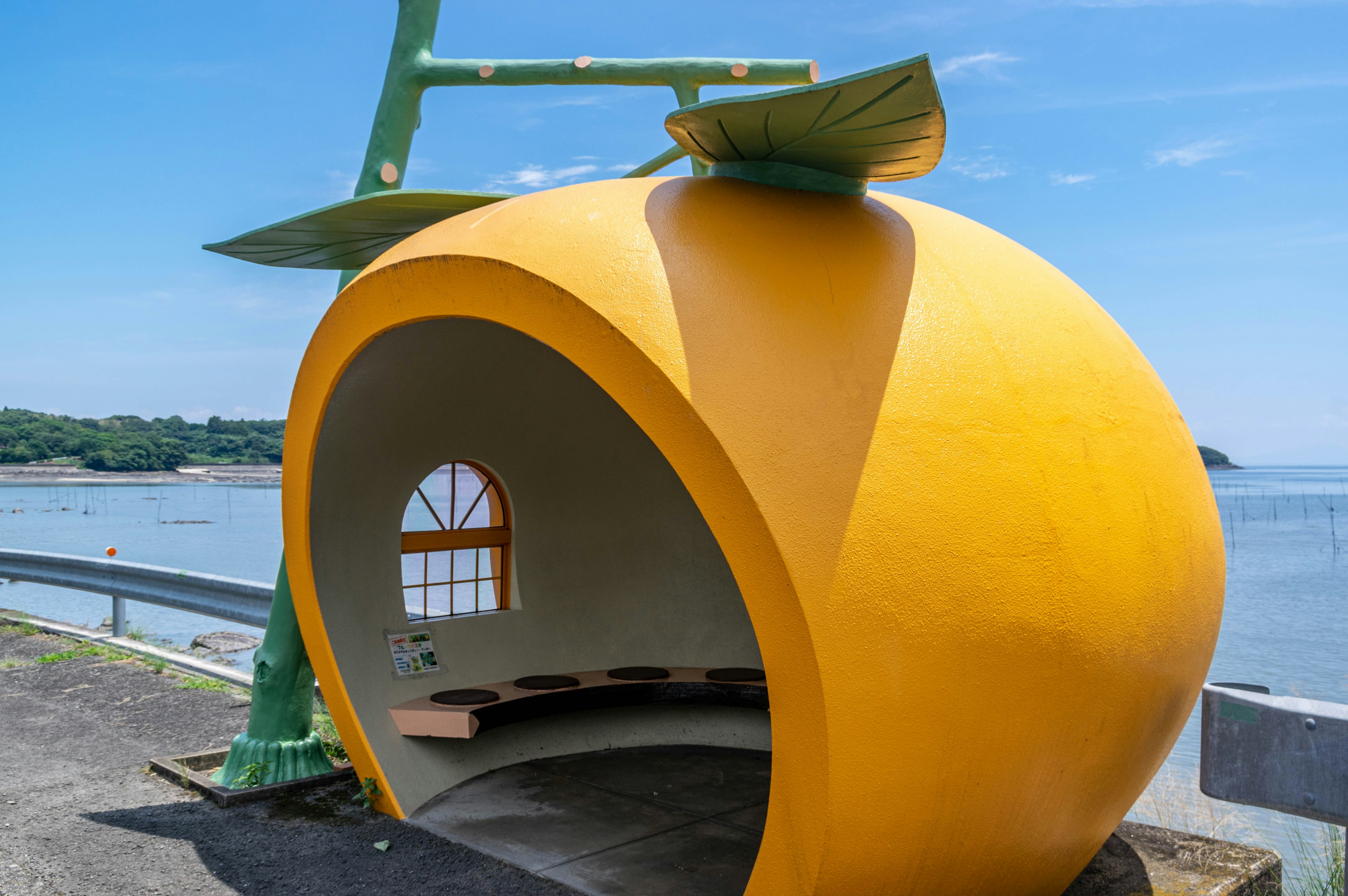 Unique orange-shaped bench with a view of the sea