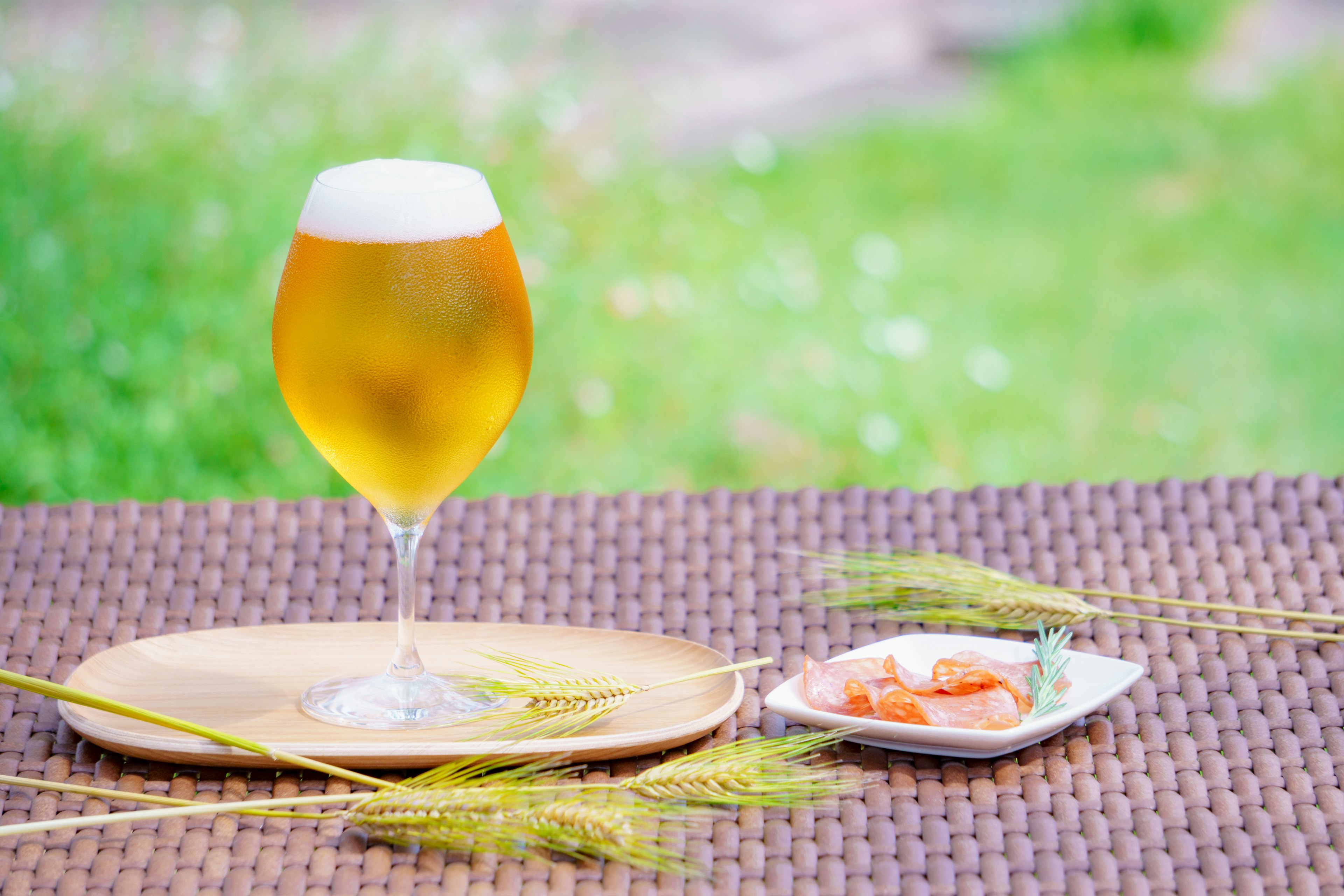 Image of a table setting with a beer and snacks