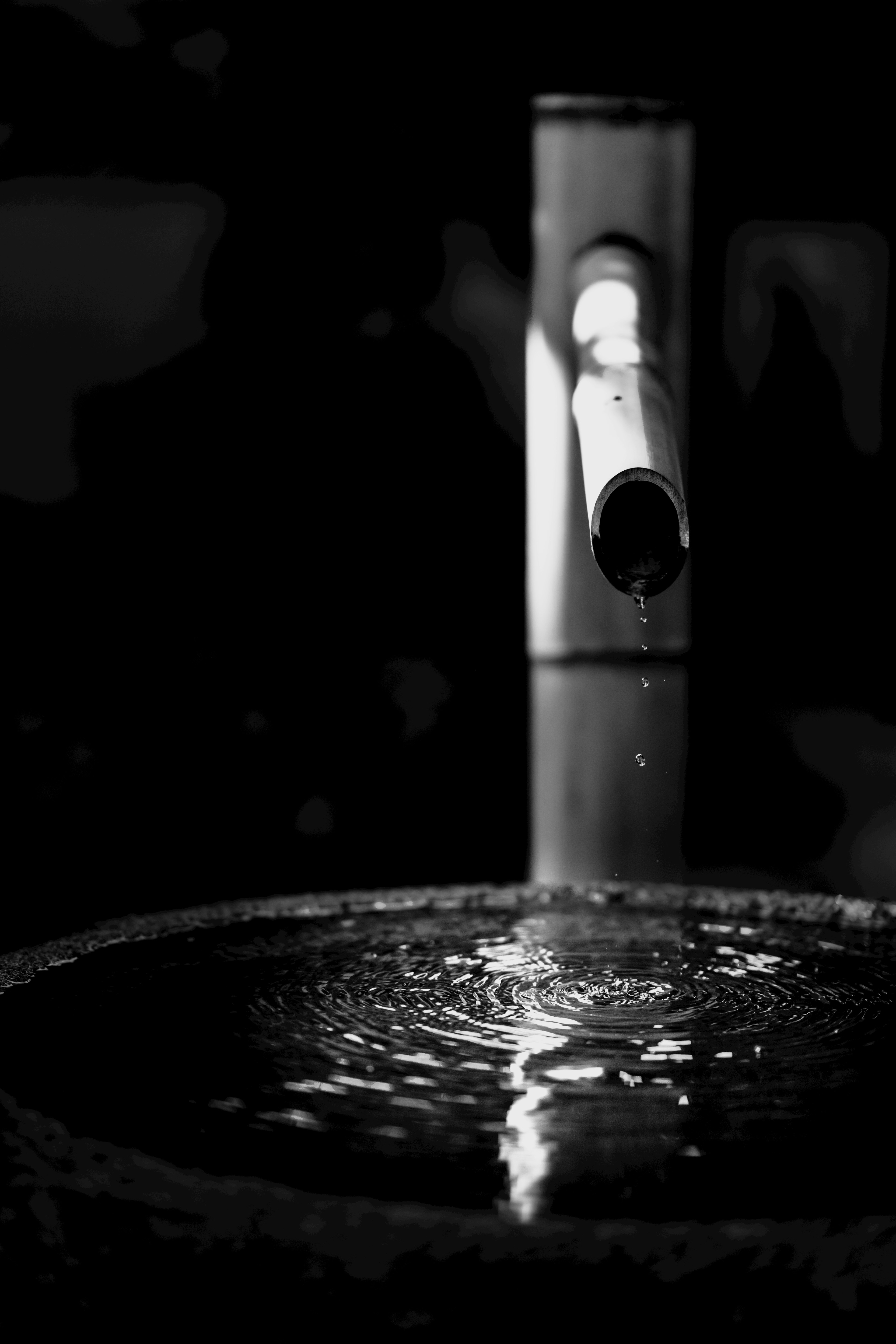 Close-up shot of a modern fountain with flowing water