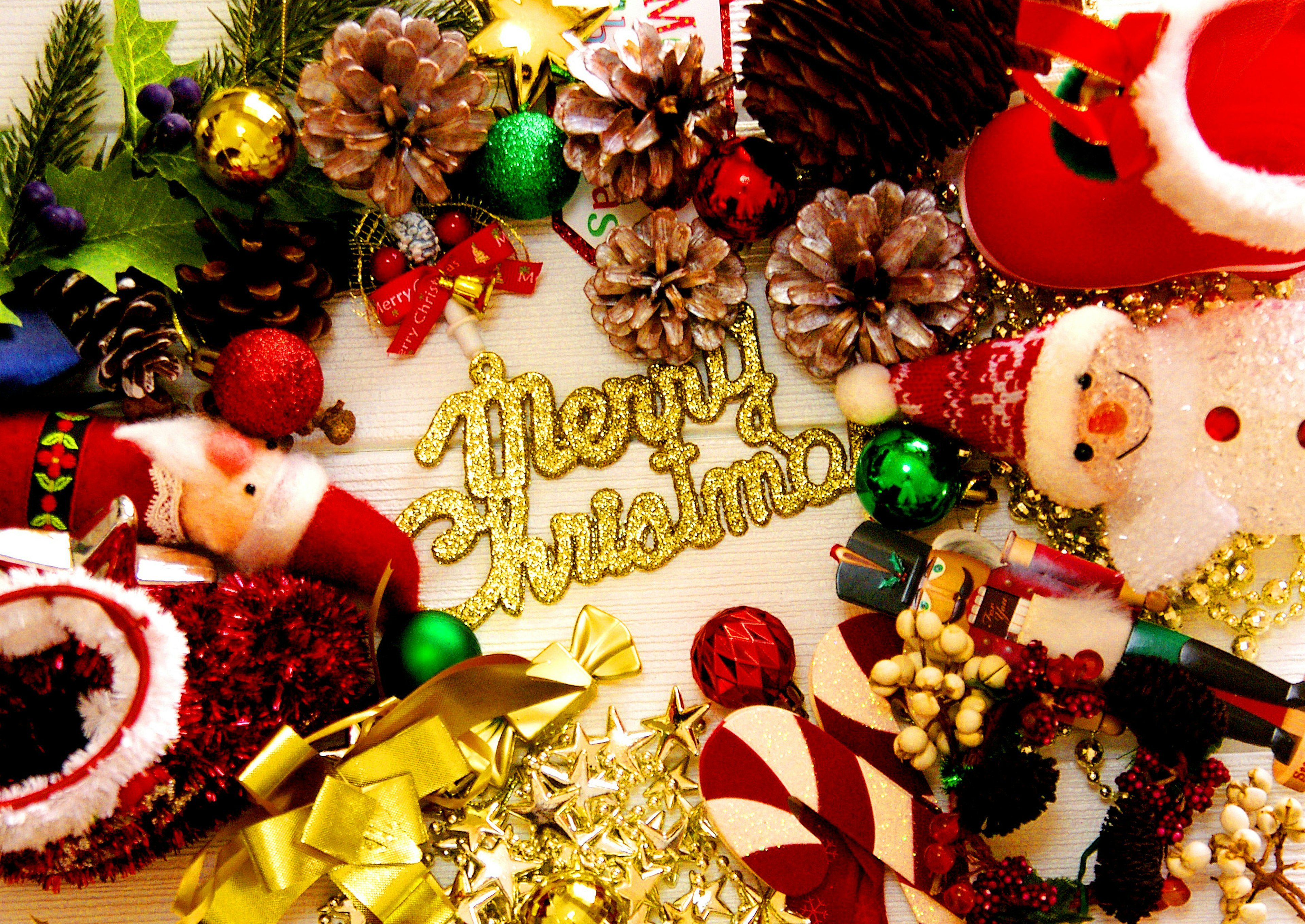 Festive arrangement featuring Merry Christmas text surrounded by decorations