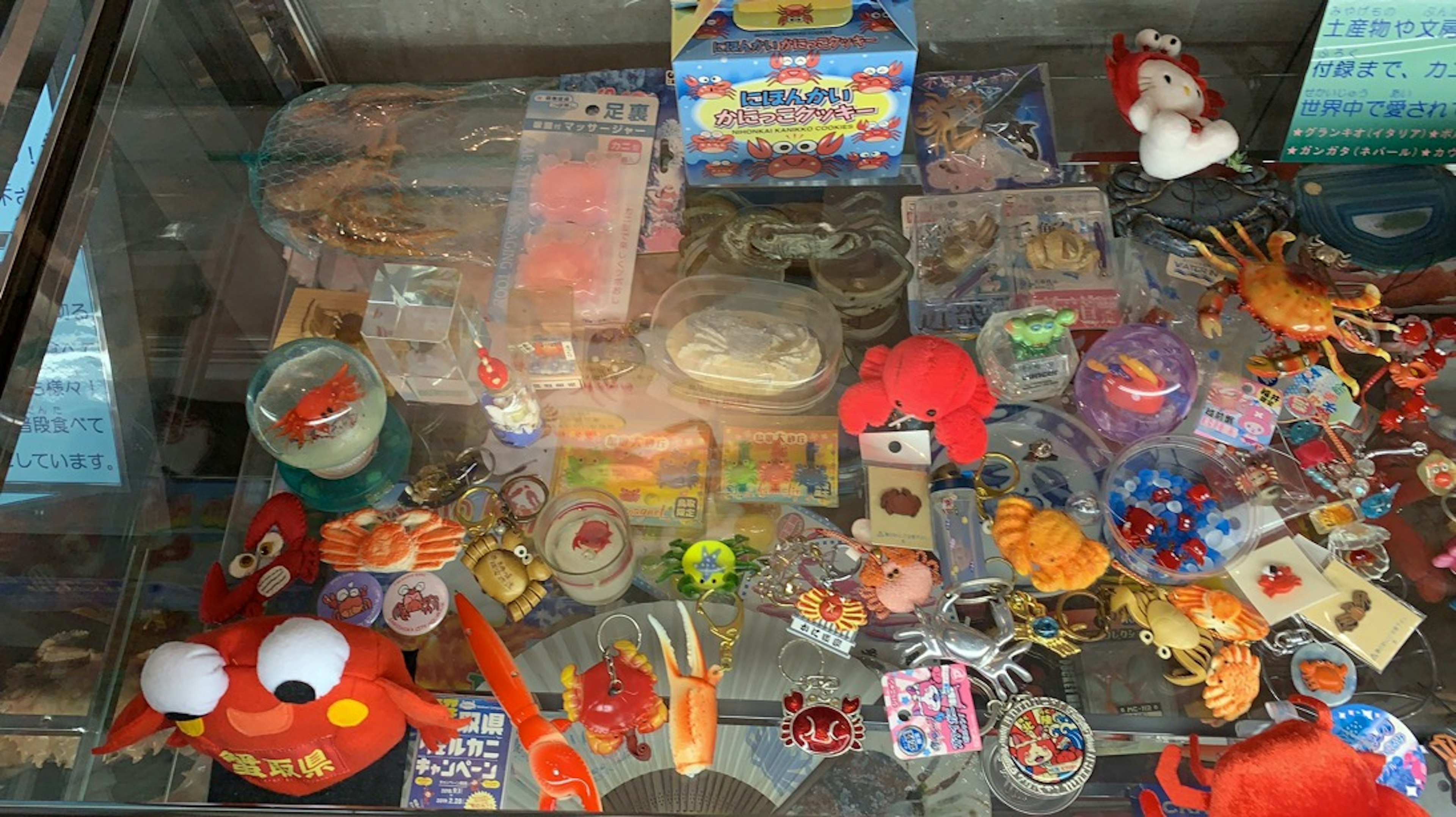 Colorful toys and trinkets displayed in a glass case