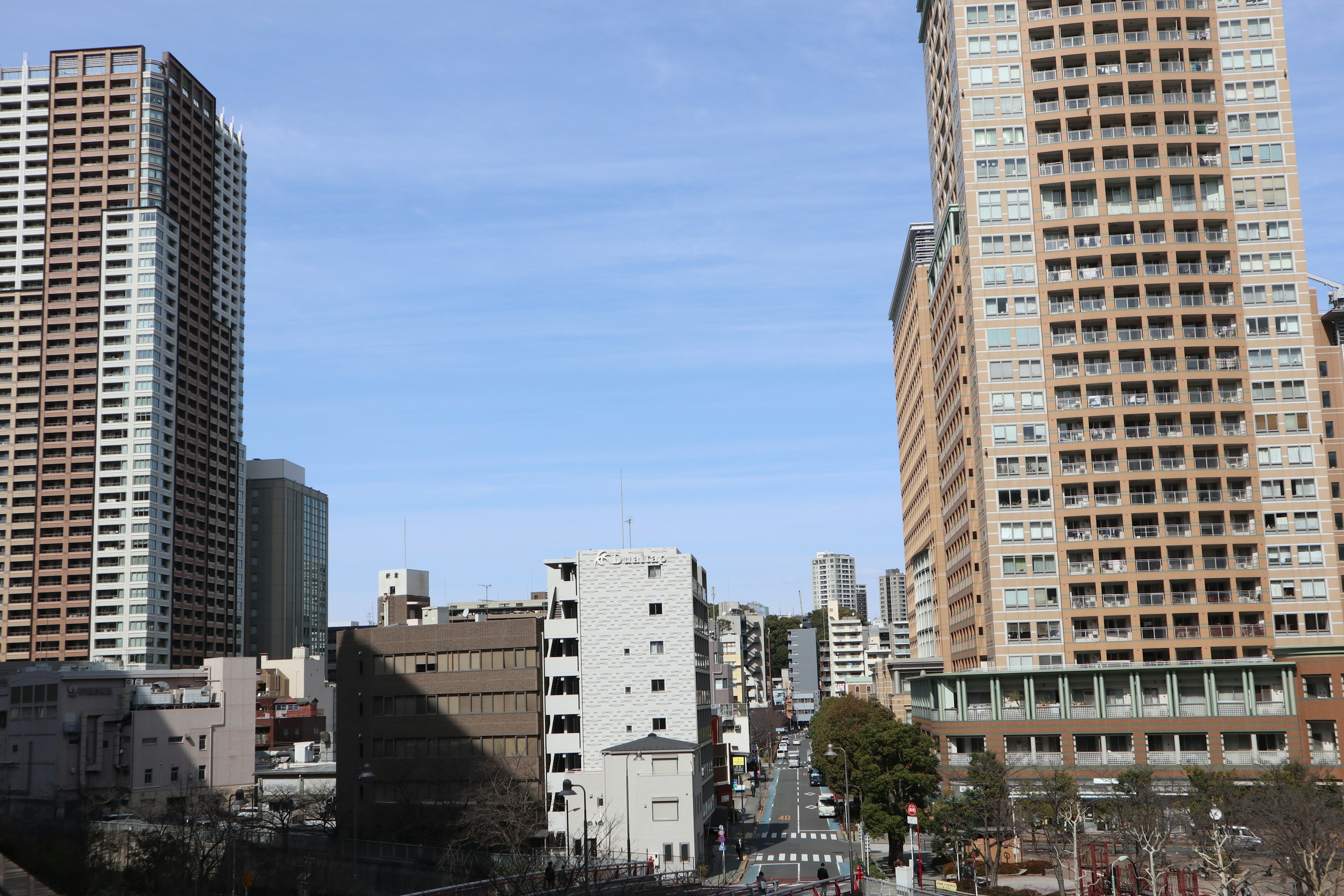 Urban landscape with tall buildings and clear blue sky