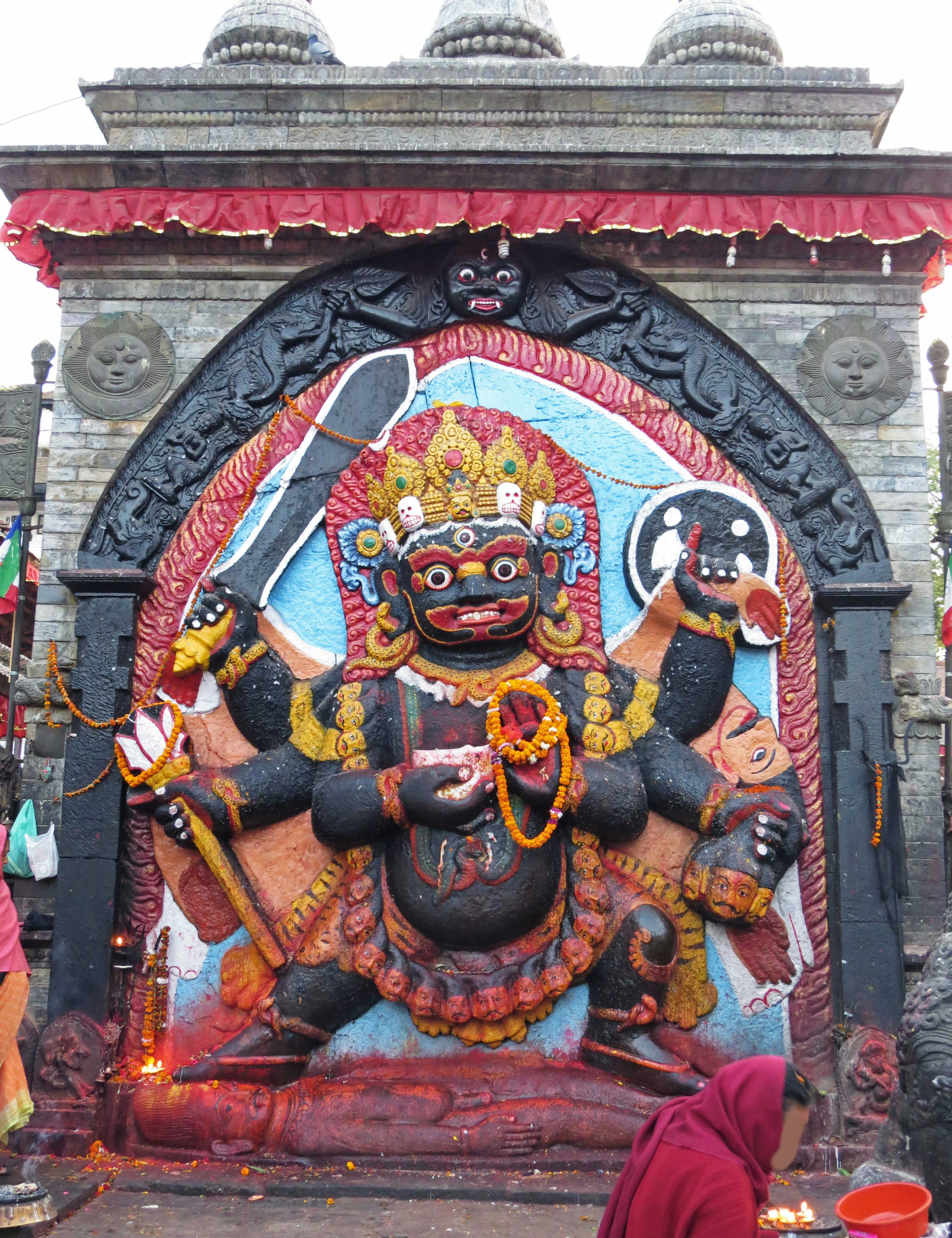 Colorful sculpture of Goddess Kali on temple wall