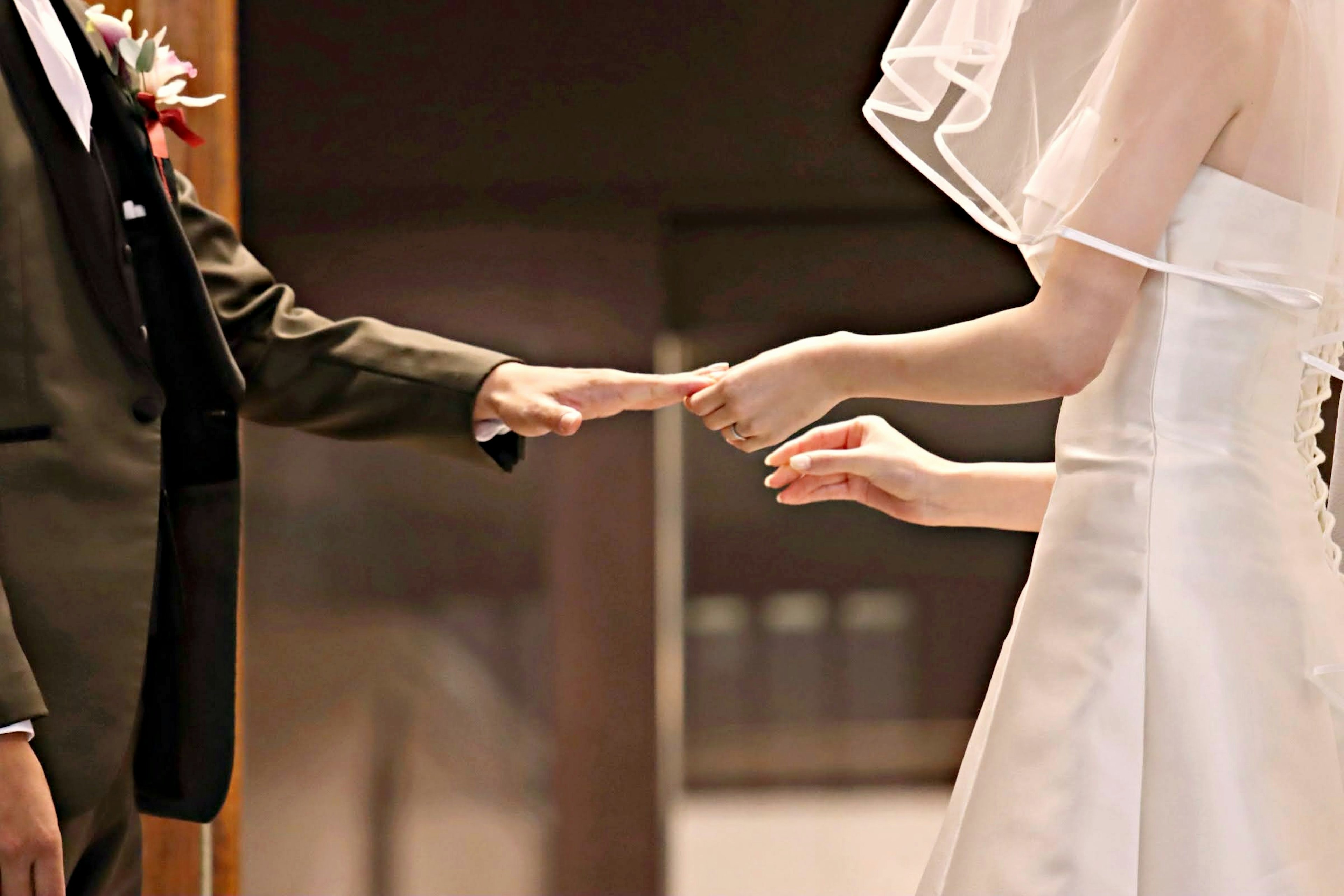 A couple holding hands during their wedding ceremony