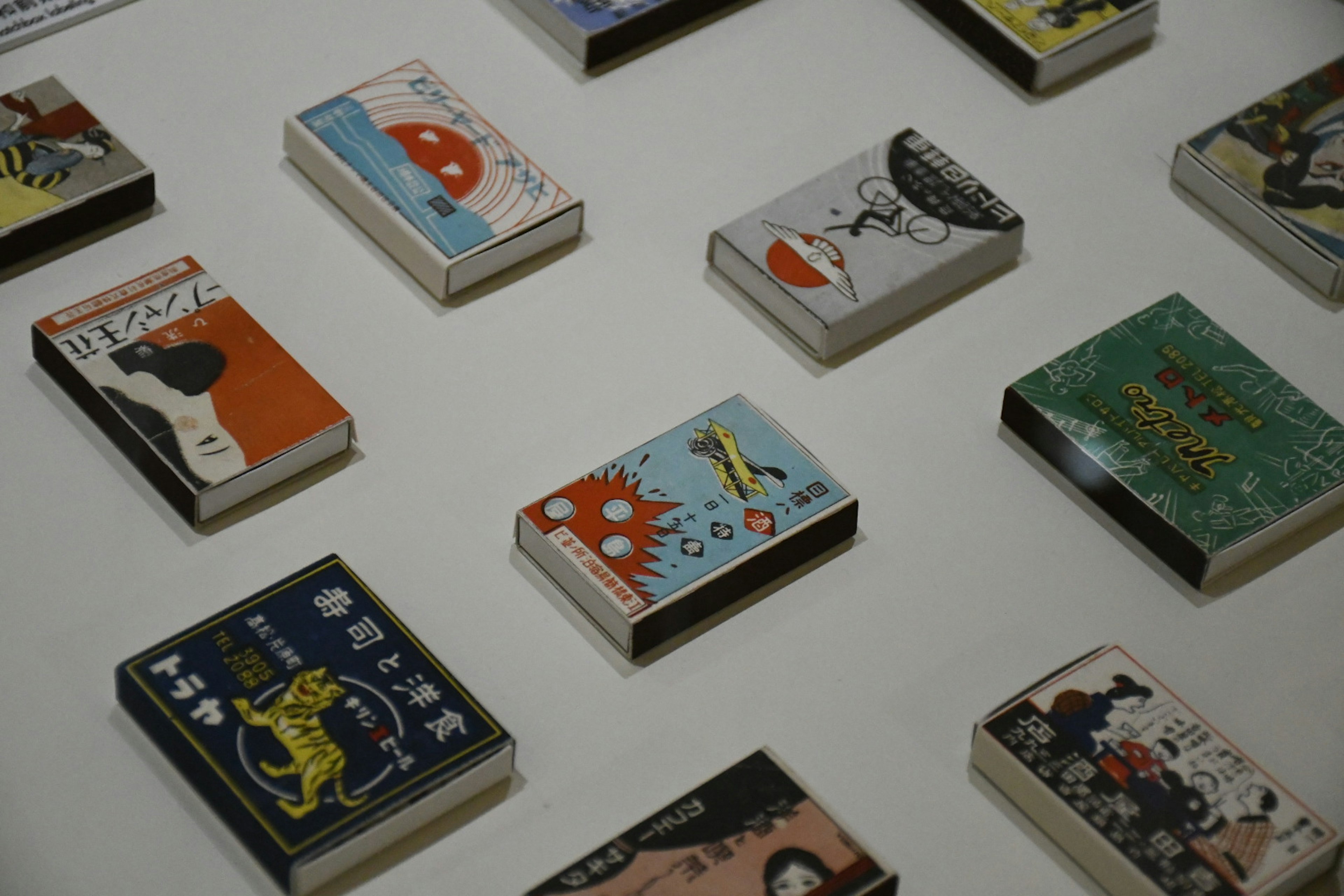 An arrangement of small books with unique cover designs