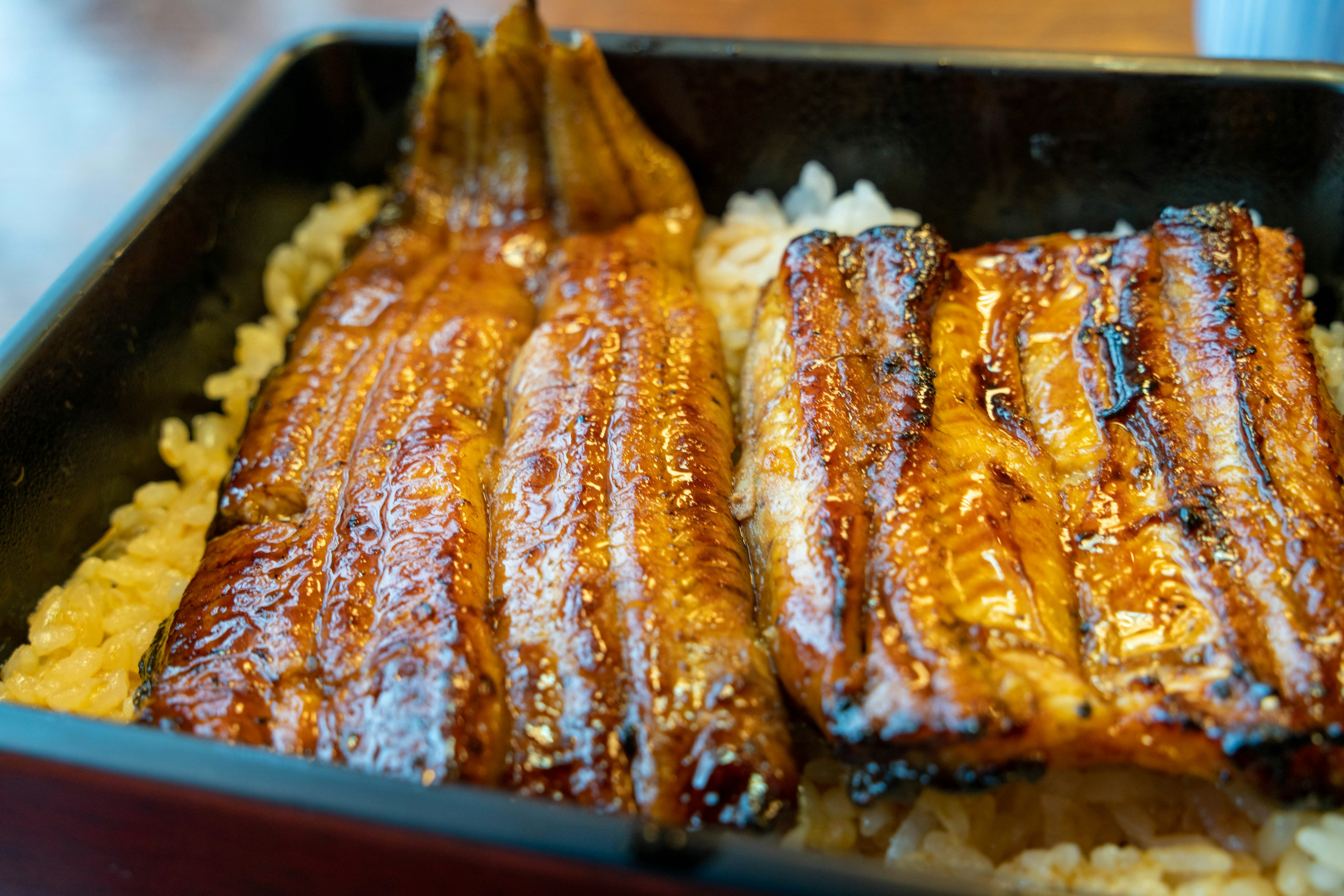 Grilled eel glazed with sauce served over rice