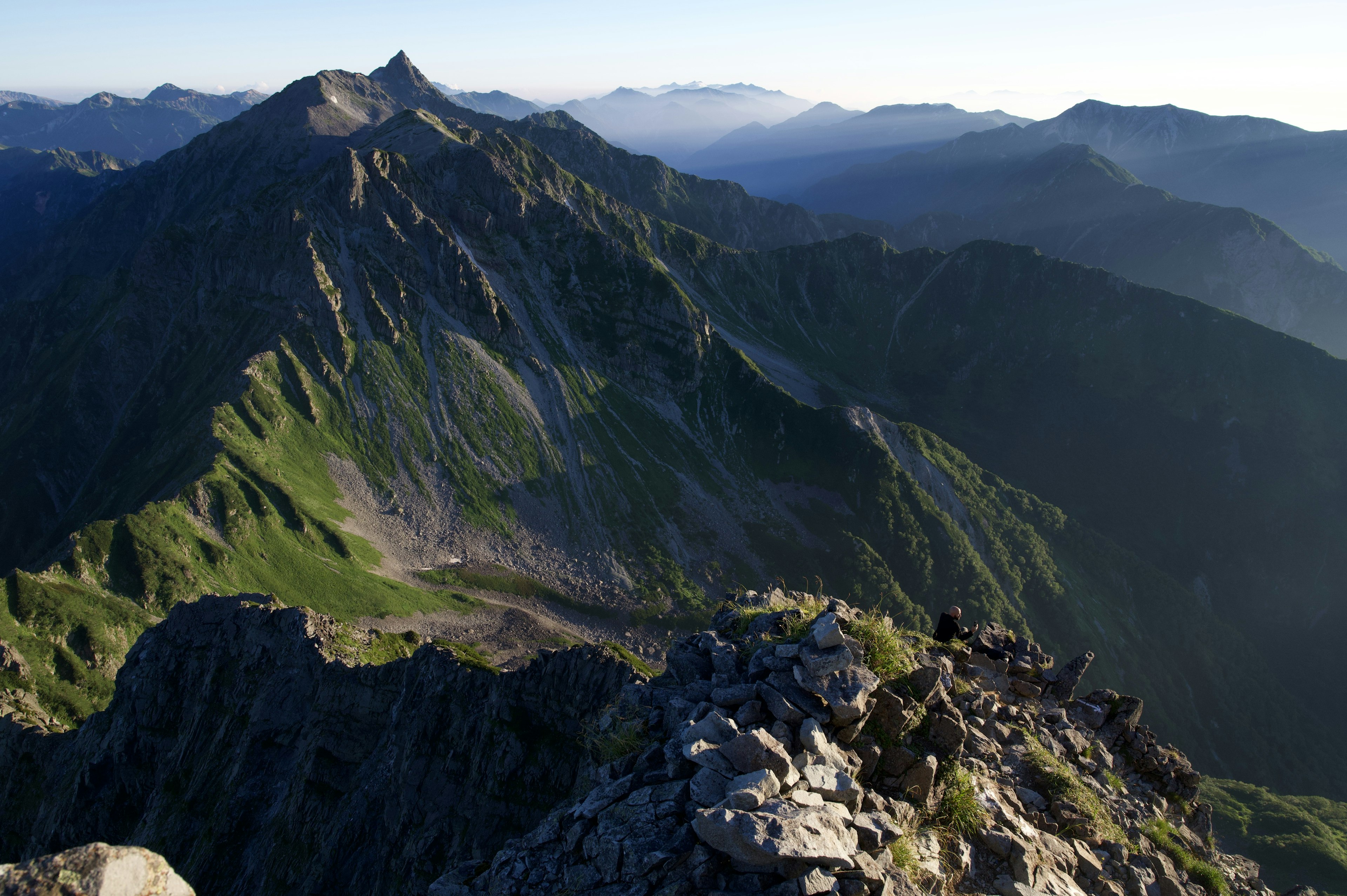 Stunning mountain landscape with lush greenery and blue sky