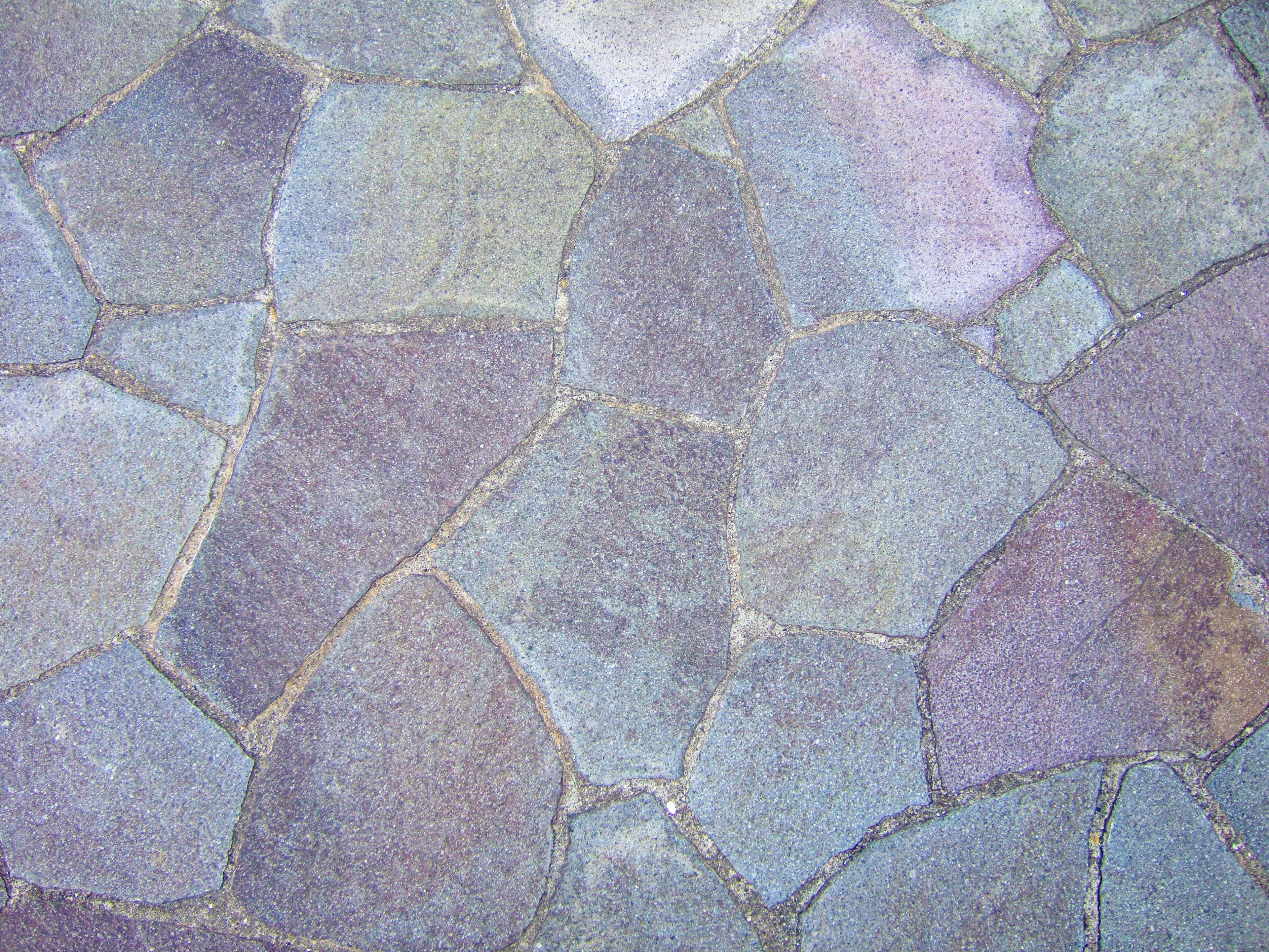 Pattern of stone pavement with varying shades of stones