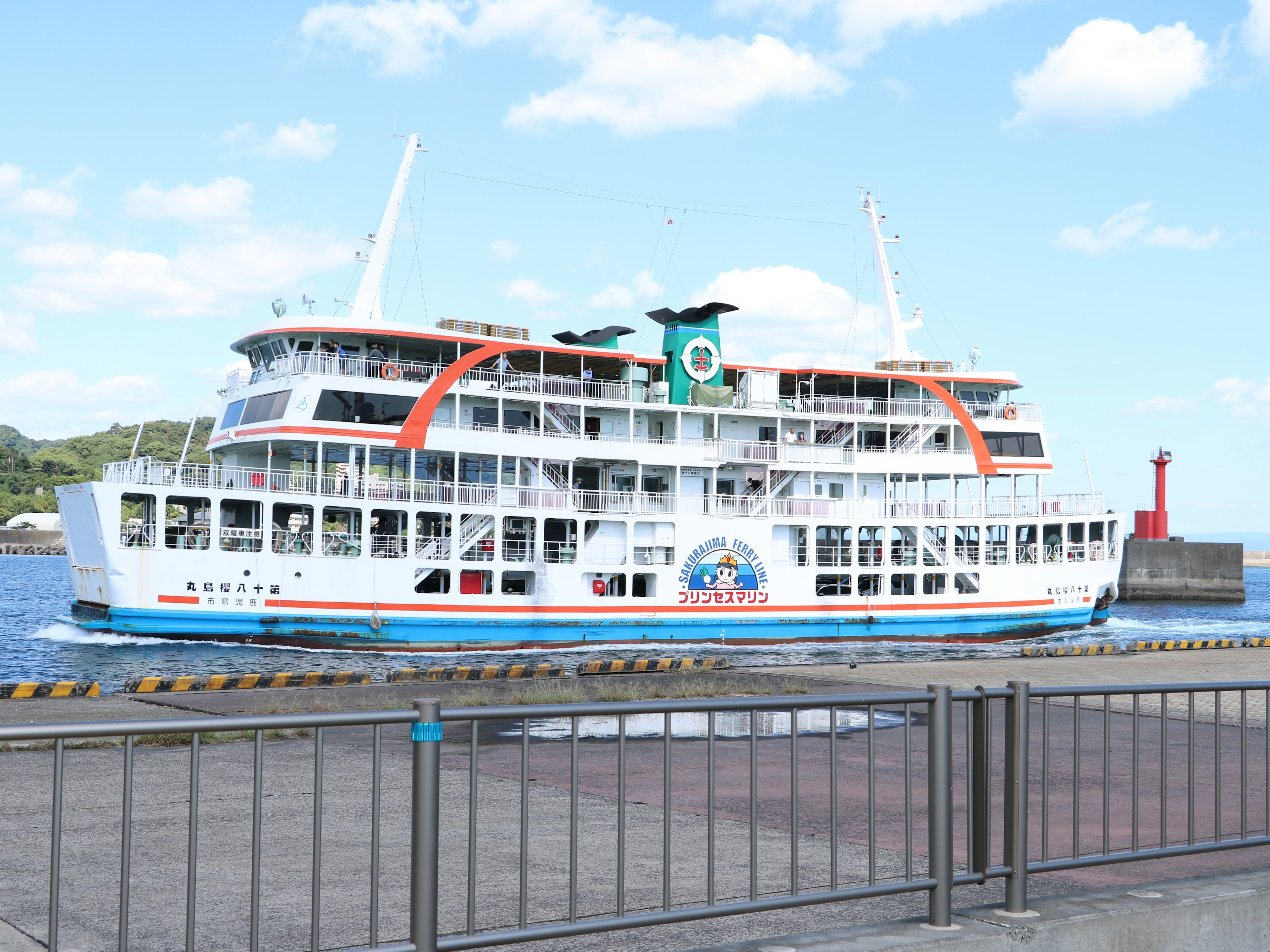 Large passenger ship docked in blue waters