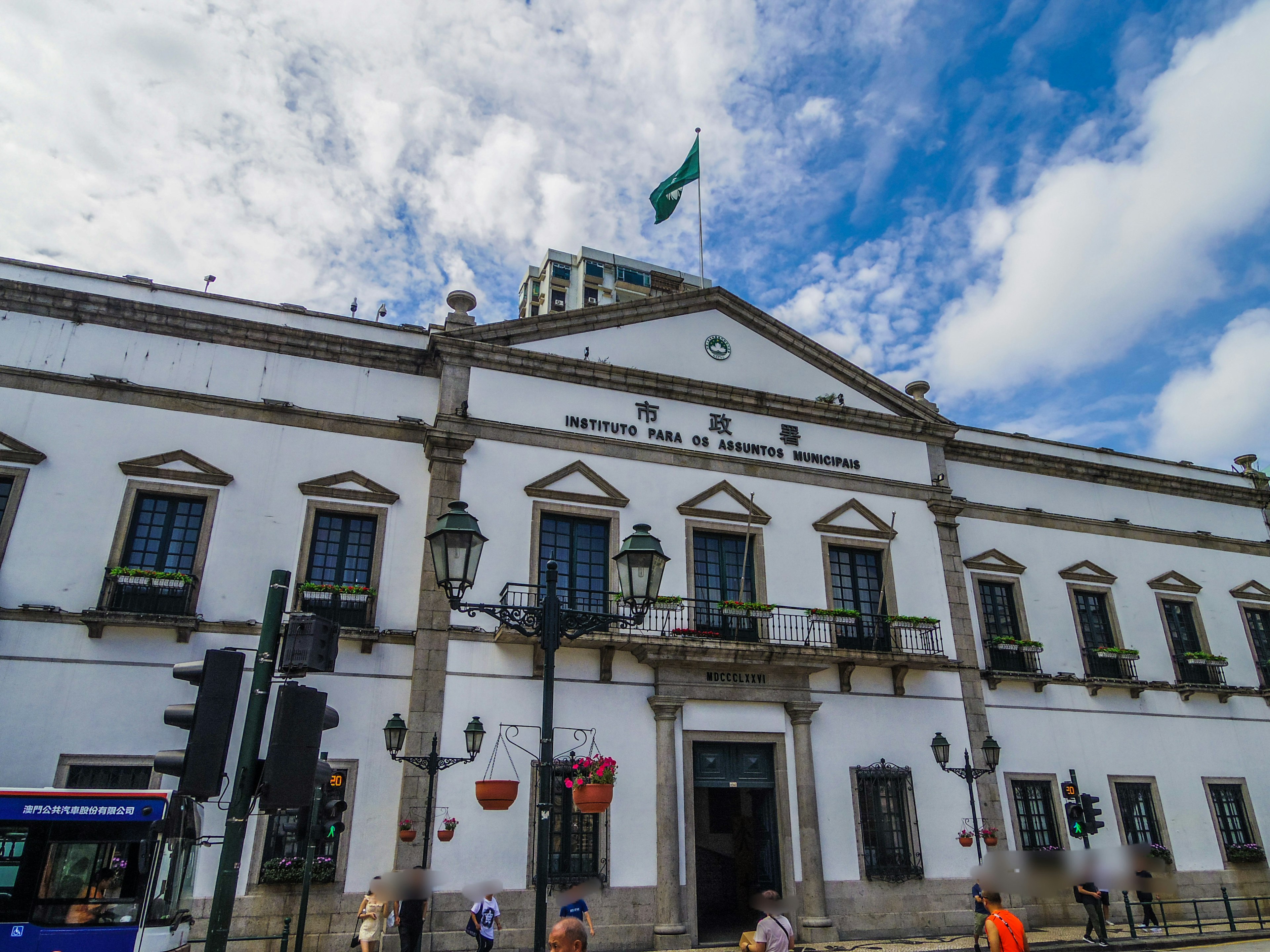 Historic white building in Mexico City with blue sky