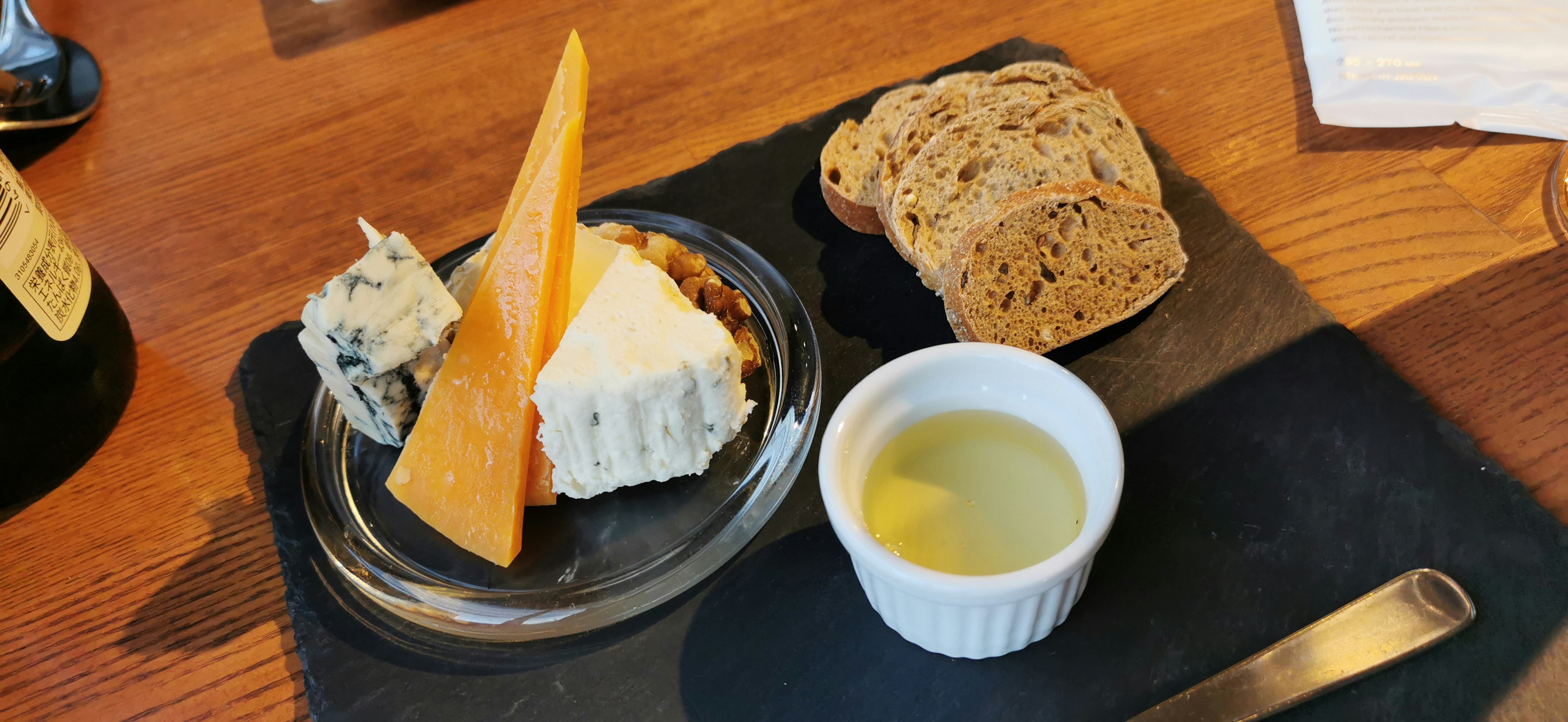 Cheese platter with various cheeses bread and olive oil