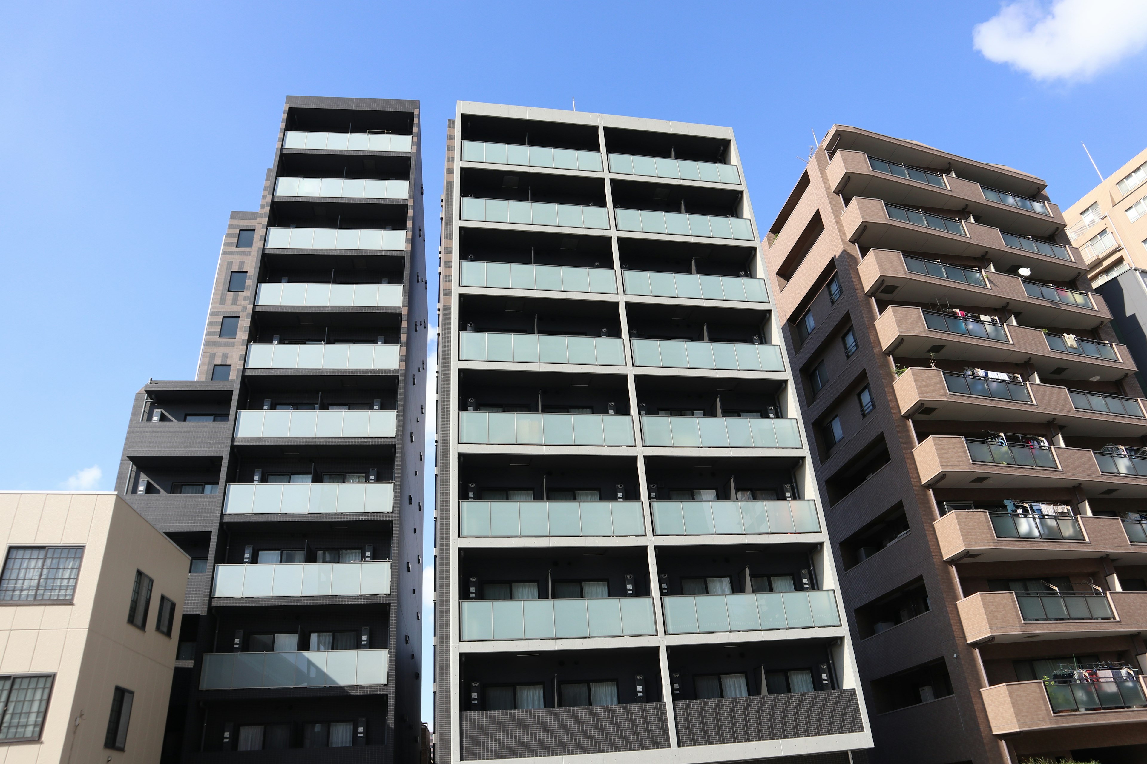 Modern apartment buildings under a blue sky