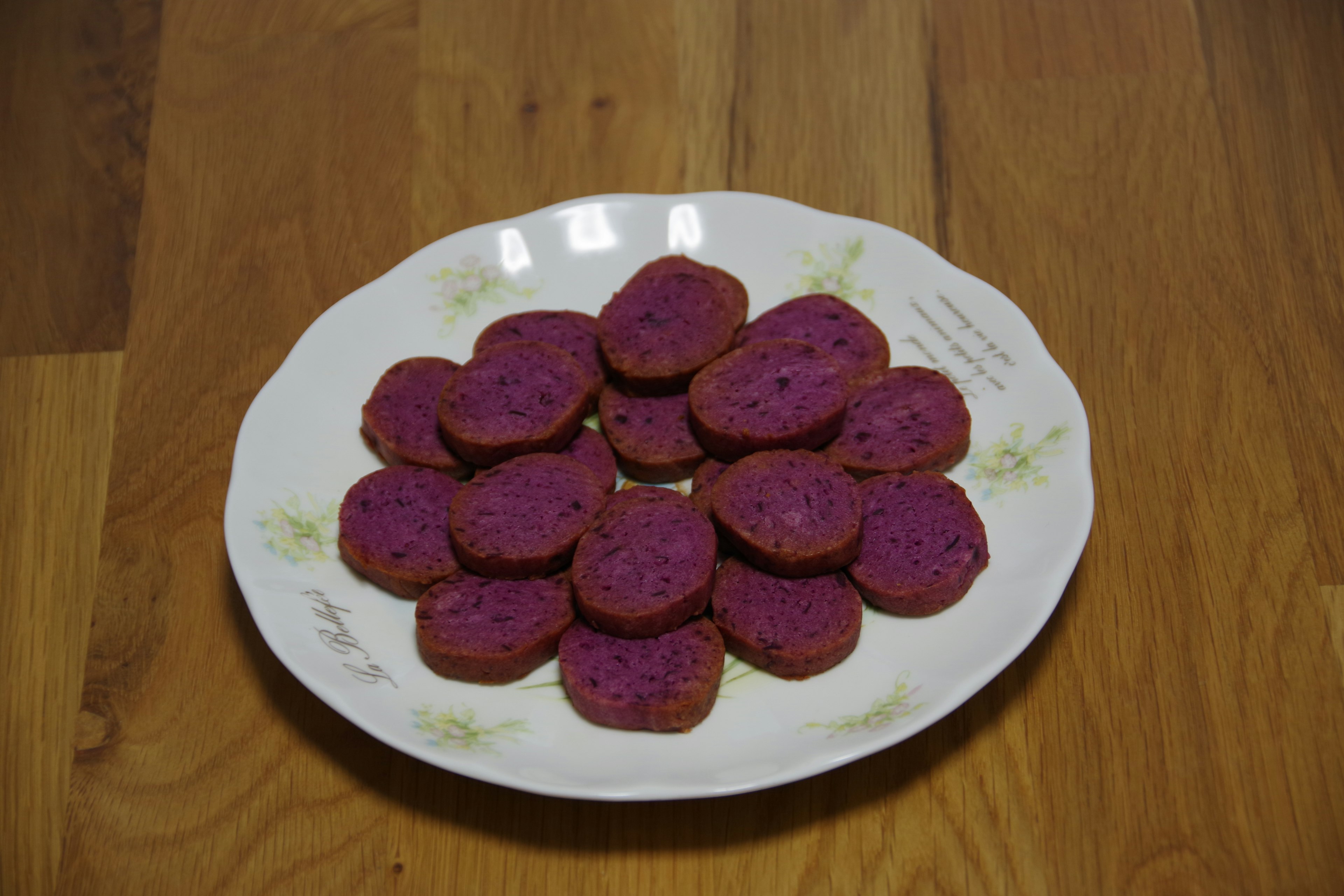 Sliced purple dessert arranged on a white plate