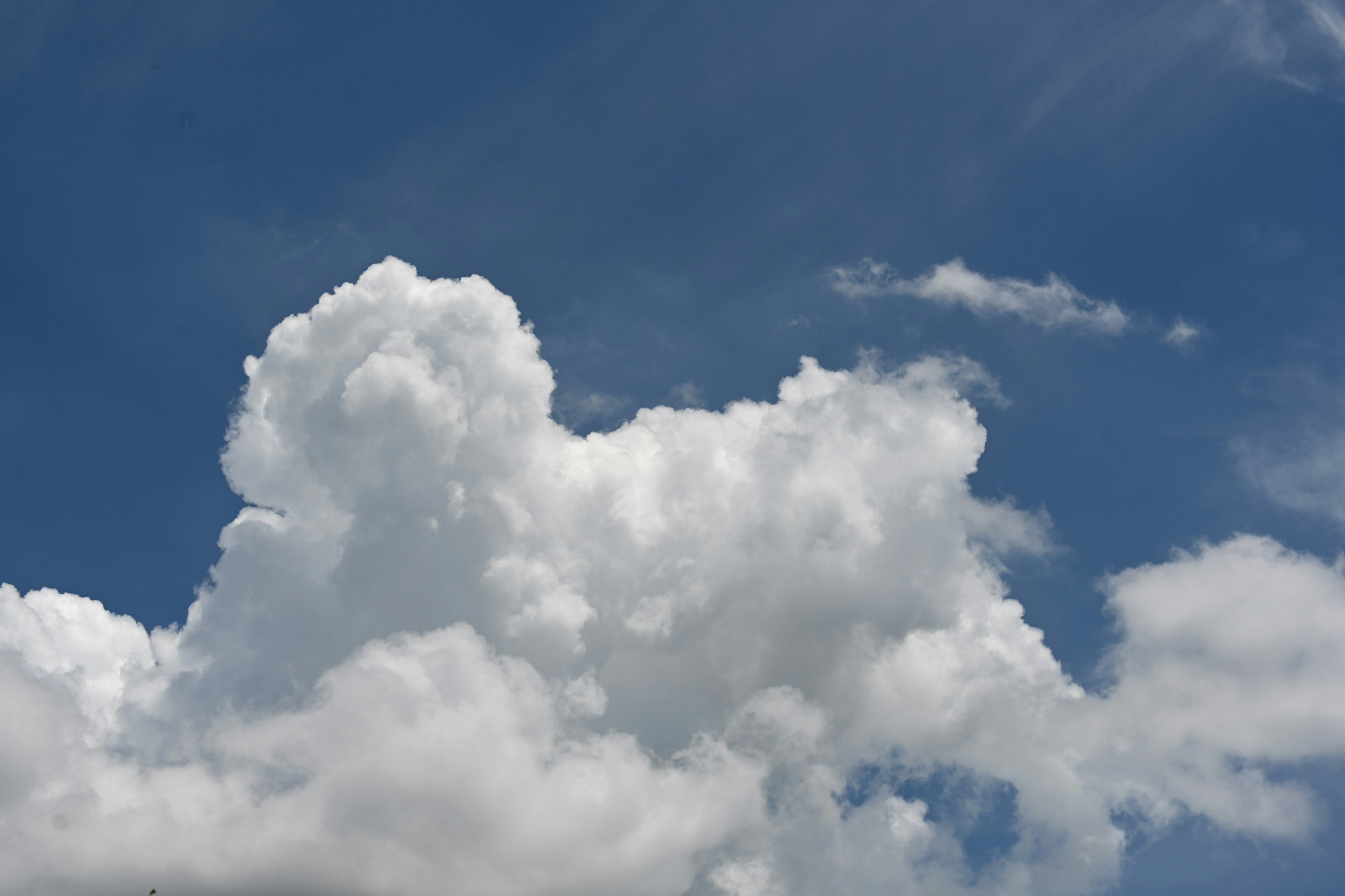 Fluffy white clouds in a blue sky