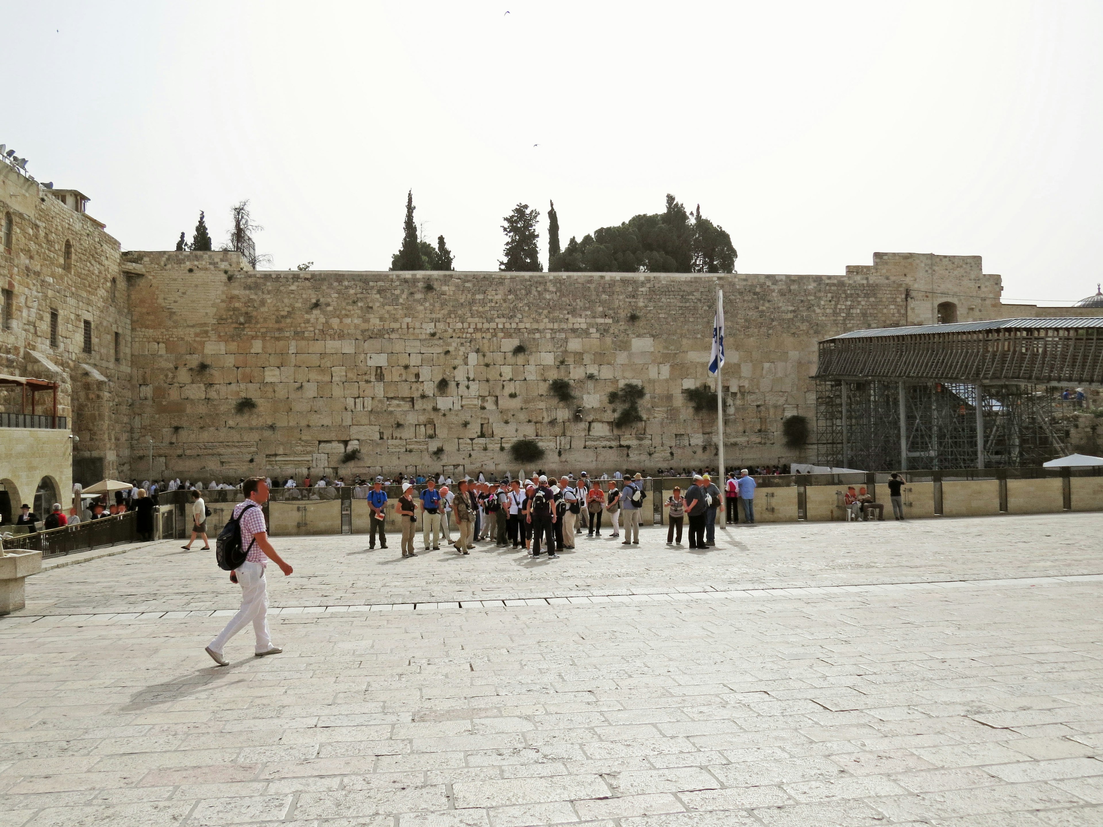 Tourists gathered in front of the Western Wall with the plaza view