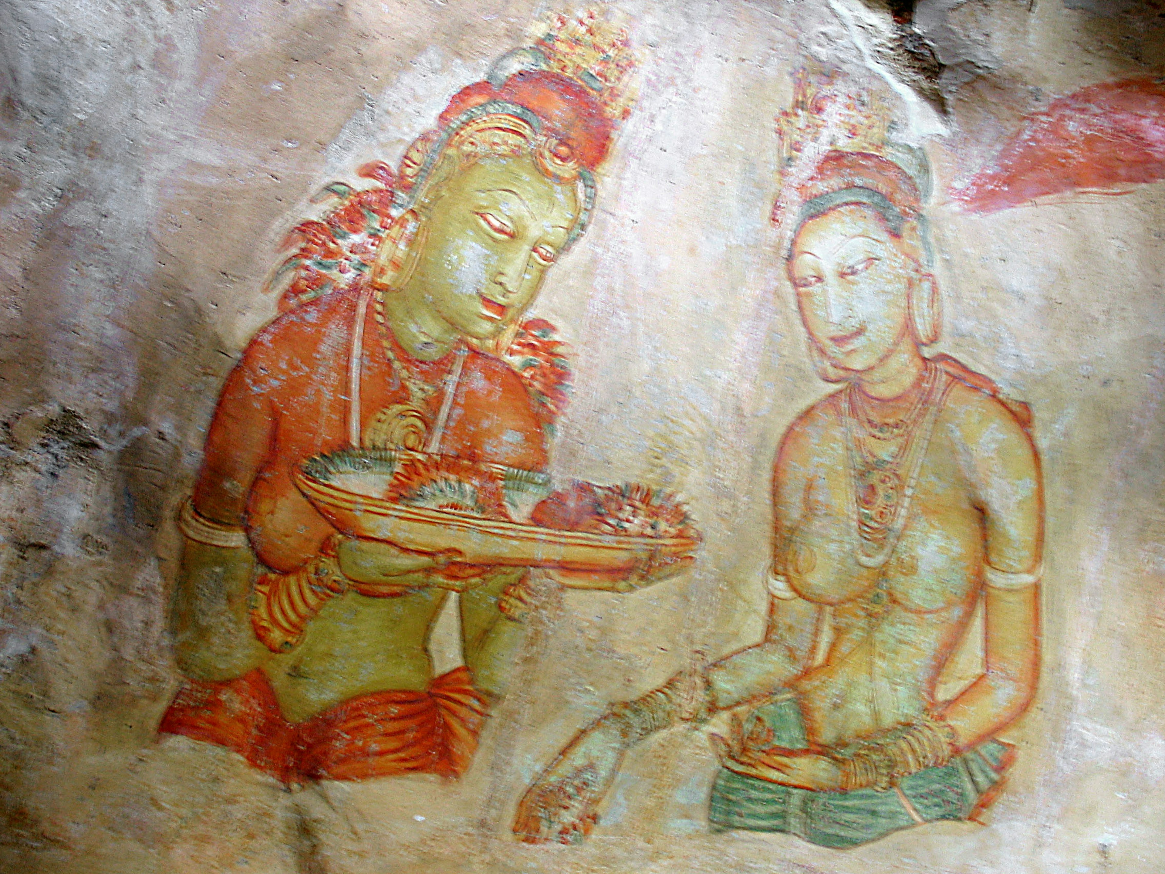 Ancient mural depicting a green deity and a beautiful woman