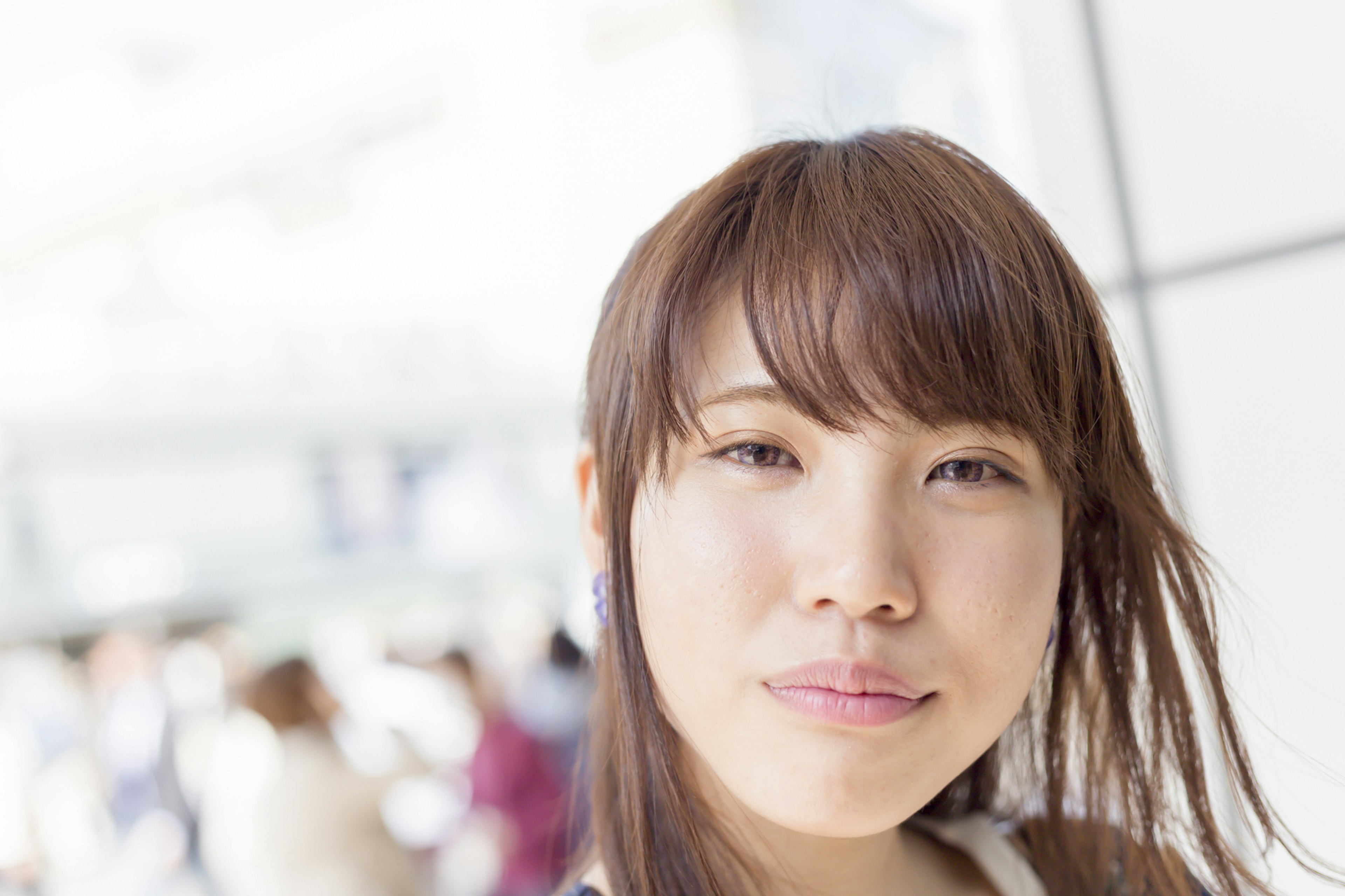 Portrait of a woman with blurred background of people