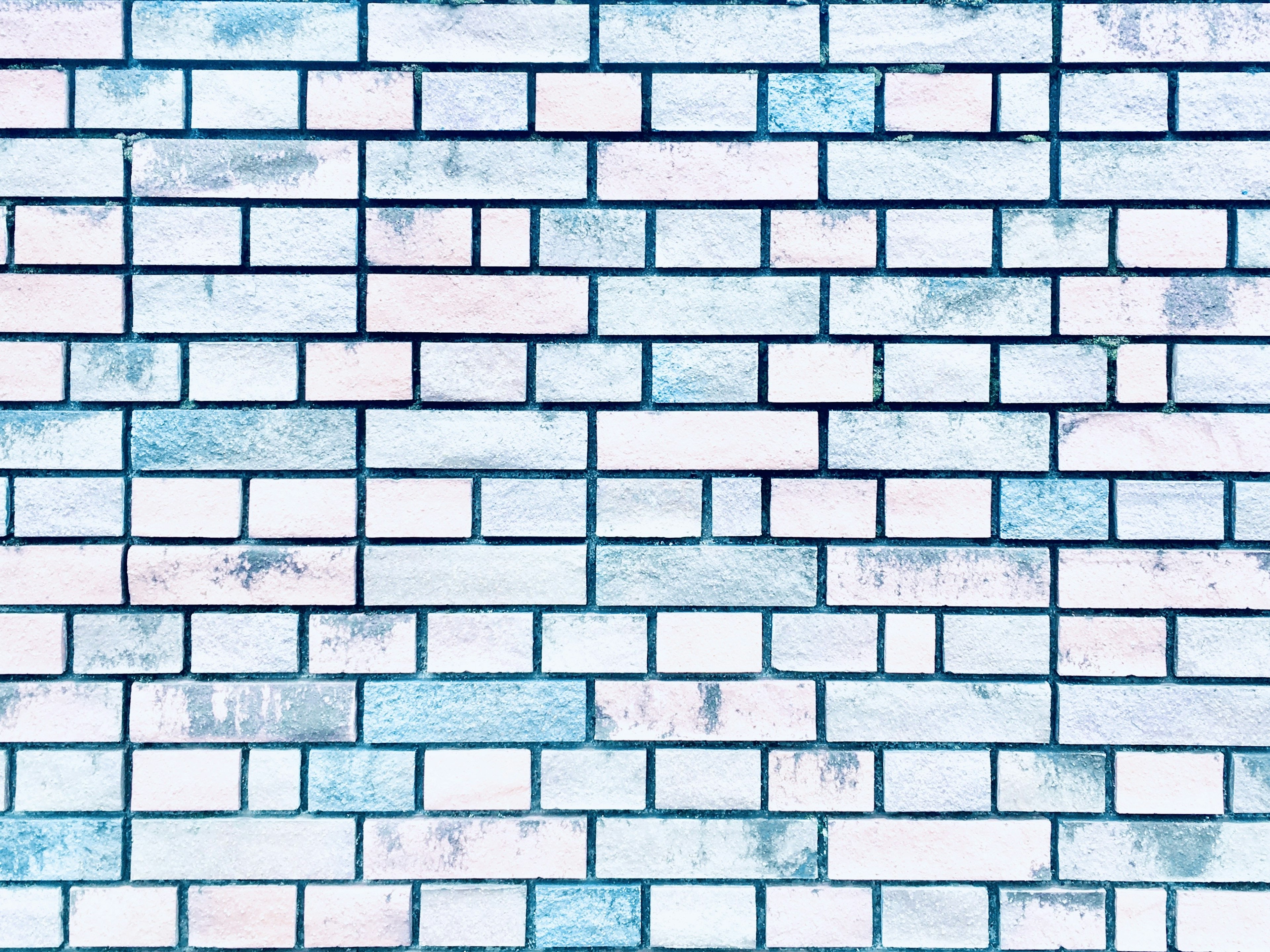 Textured blue and white brick wall